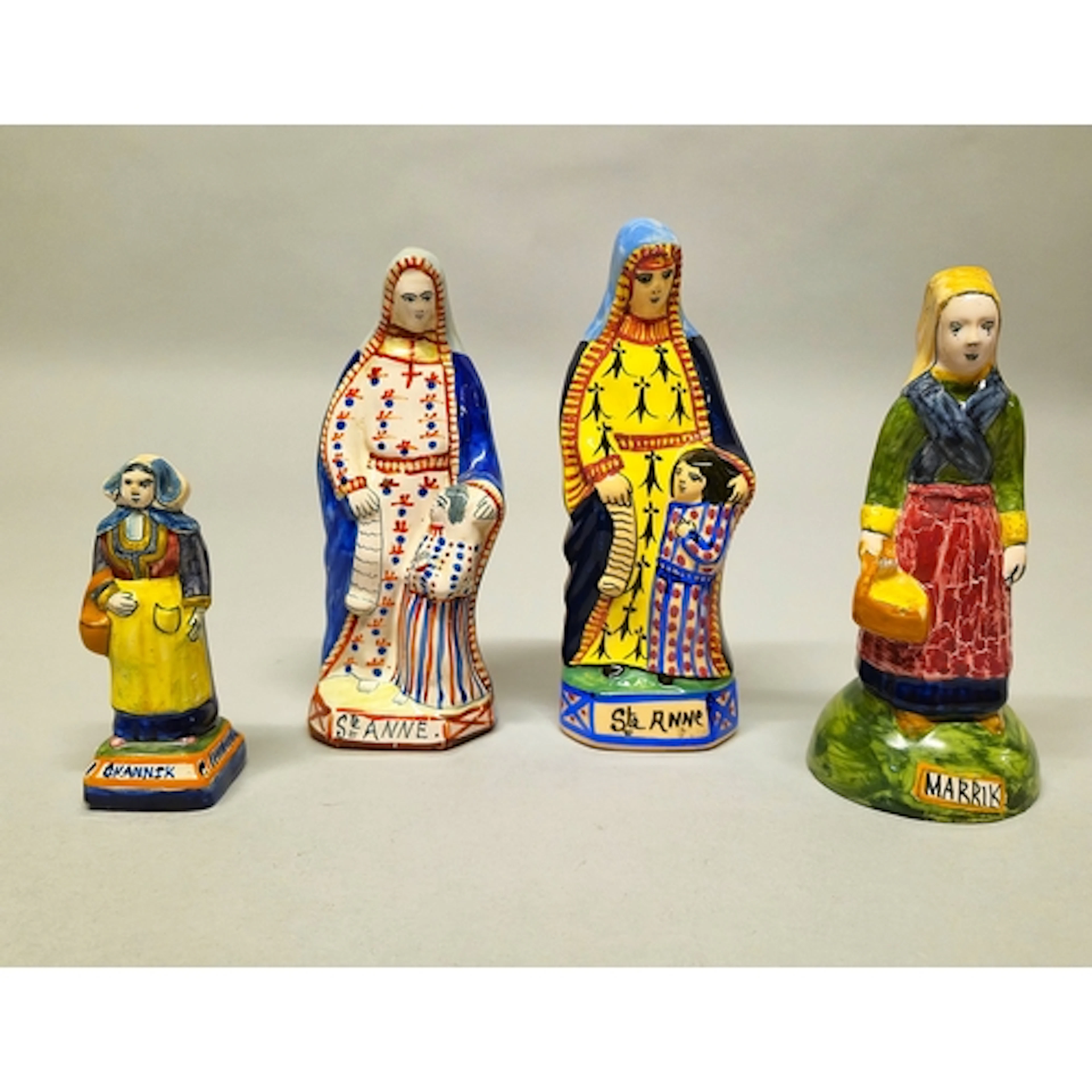 Four French glazed ceramic figures by Quimper, Modelled as S...