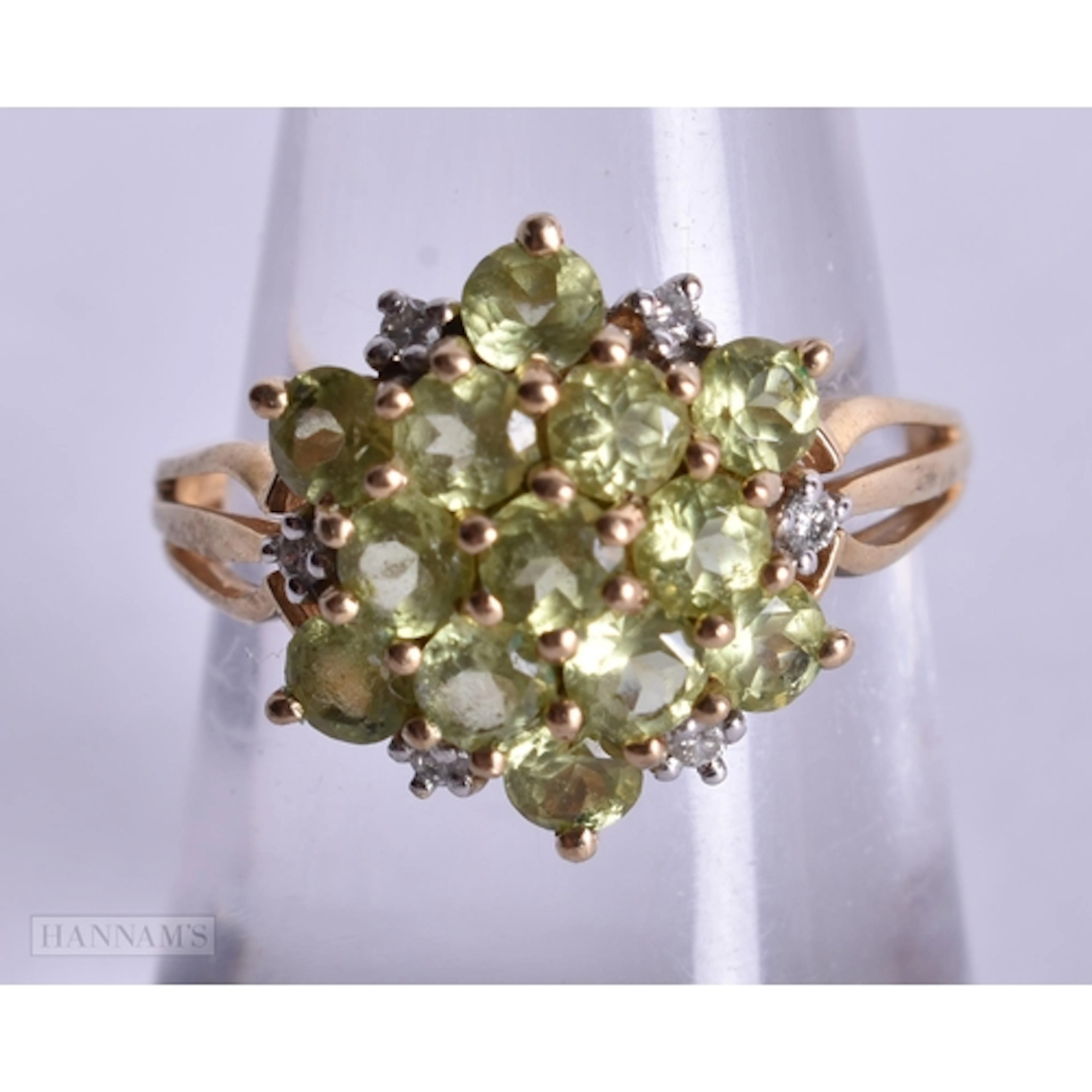 9ct peridot and diamond cluster set ring (2.4g). L 1/2.