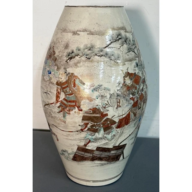 A Japanese satsuma vase featuring traditional battle scenes....