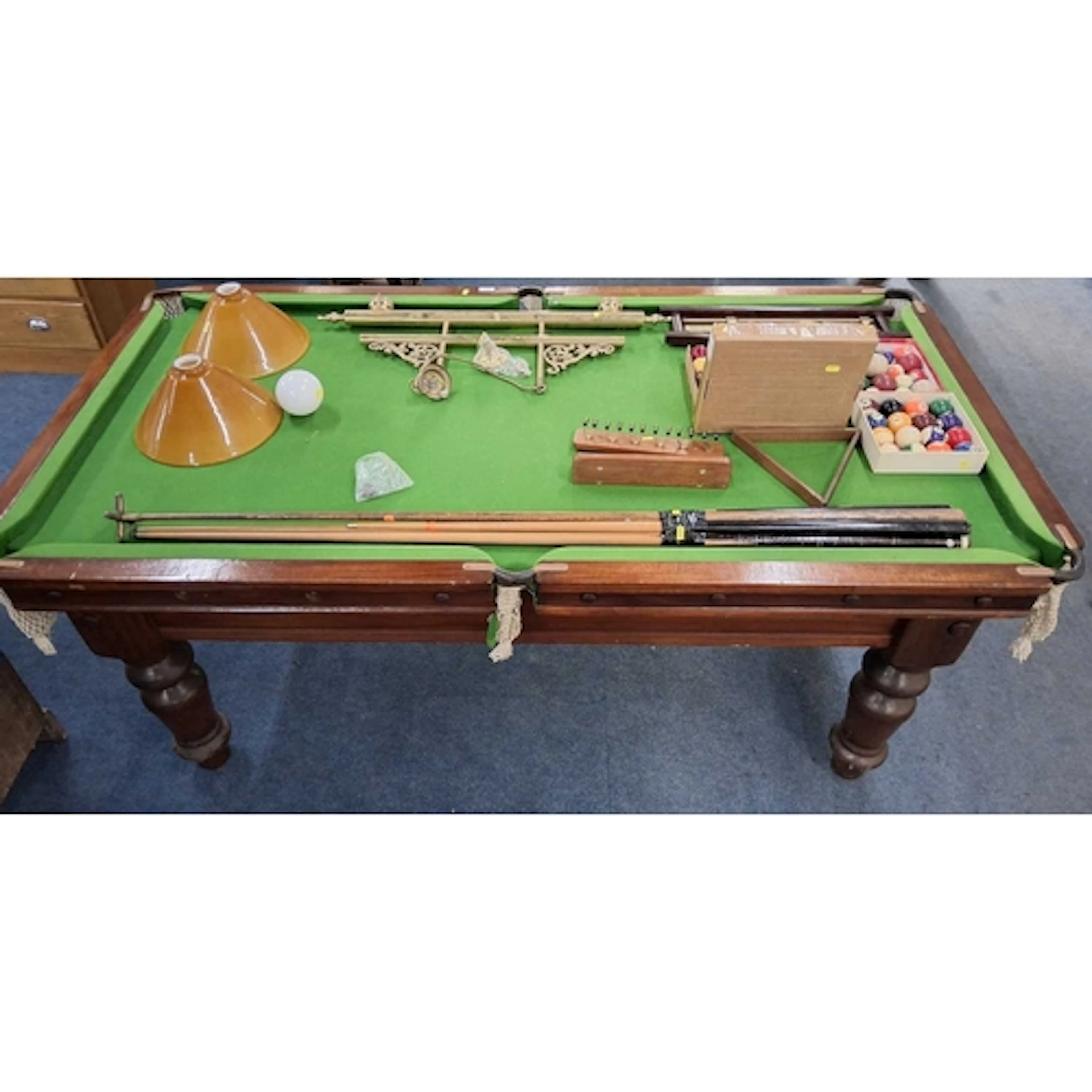 A 20TH CENTURY POOL TABLE, raised on turned legs, along with...