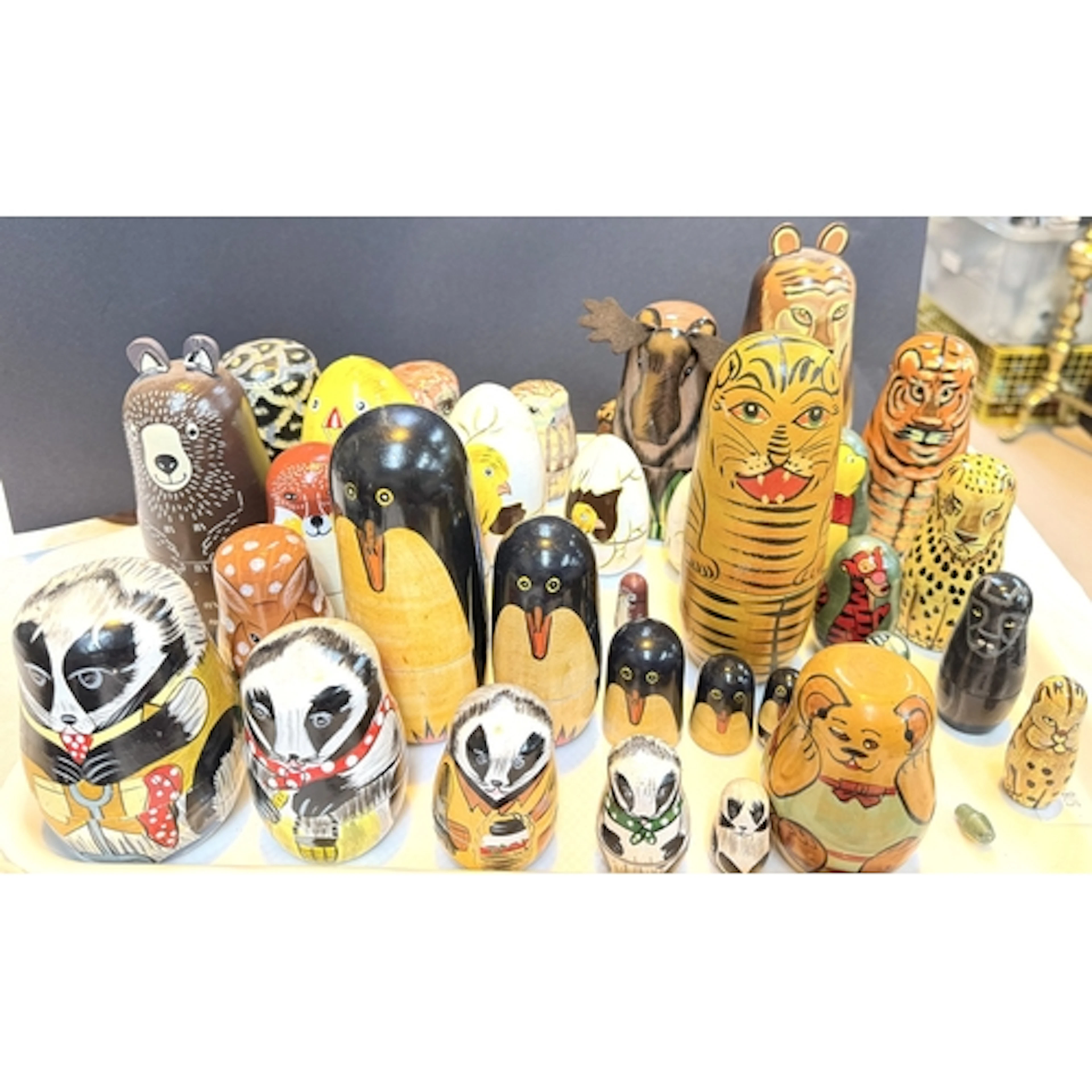 A collection of Russia Doll nest of animals including pengui...