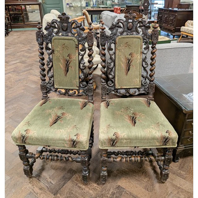 A pair of carved oak barley twist framed chairs with green p...