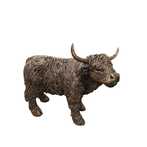 A large Highland Cow garden ornament. Resin with a metallic ...