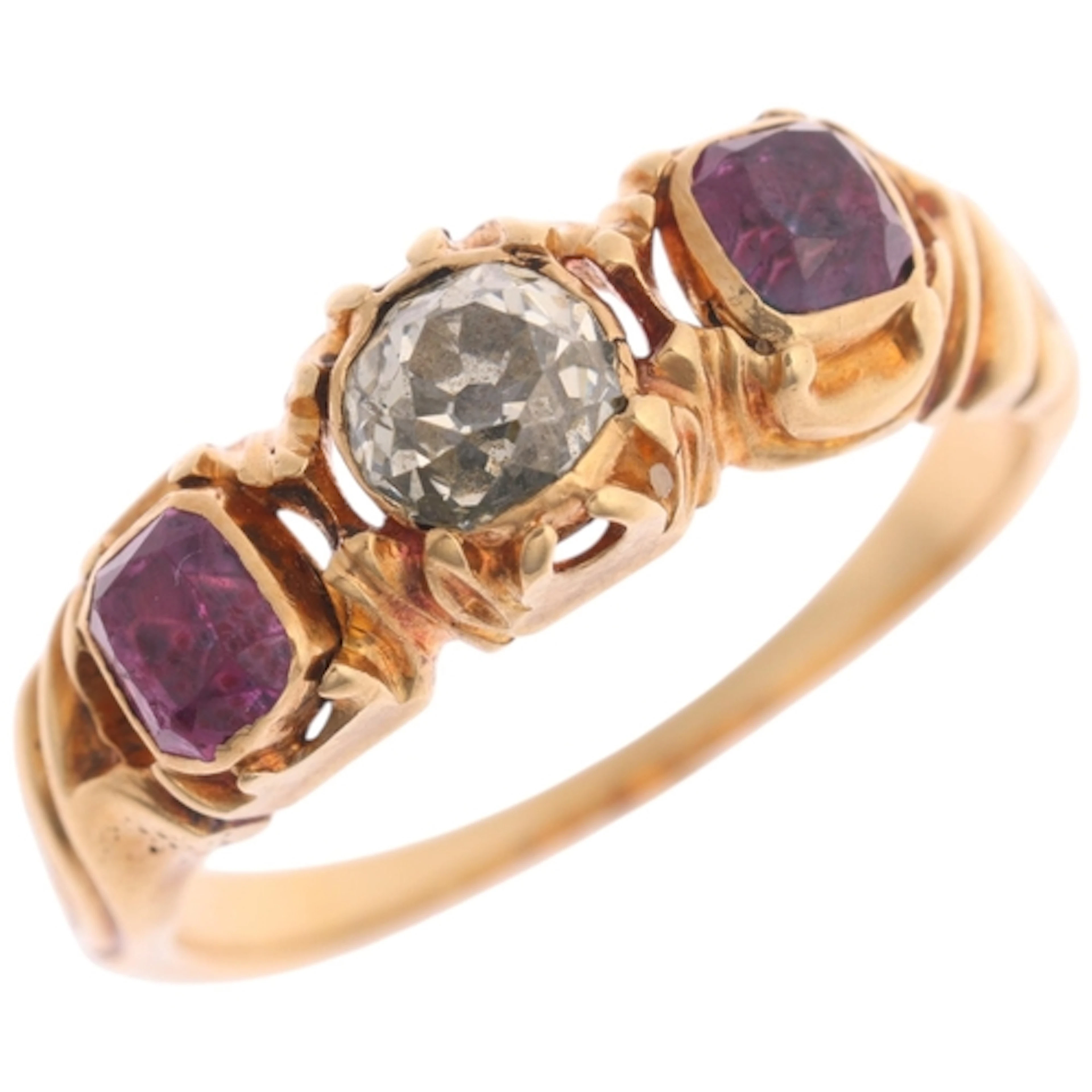An Antique 18ct gold three stone ruby and diamond ring, circ...