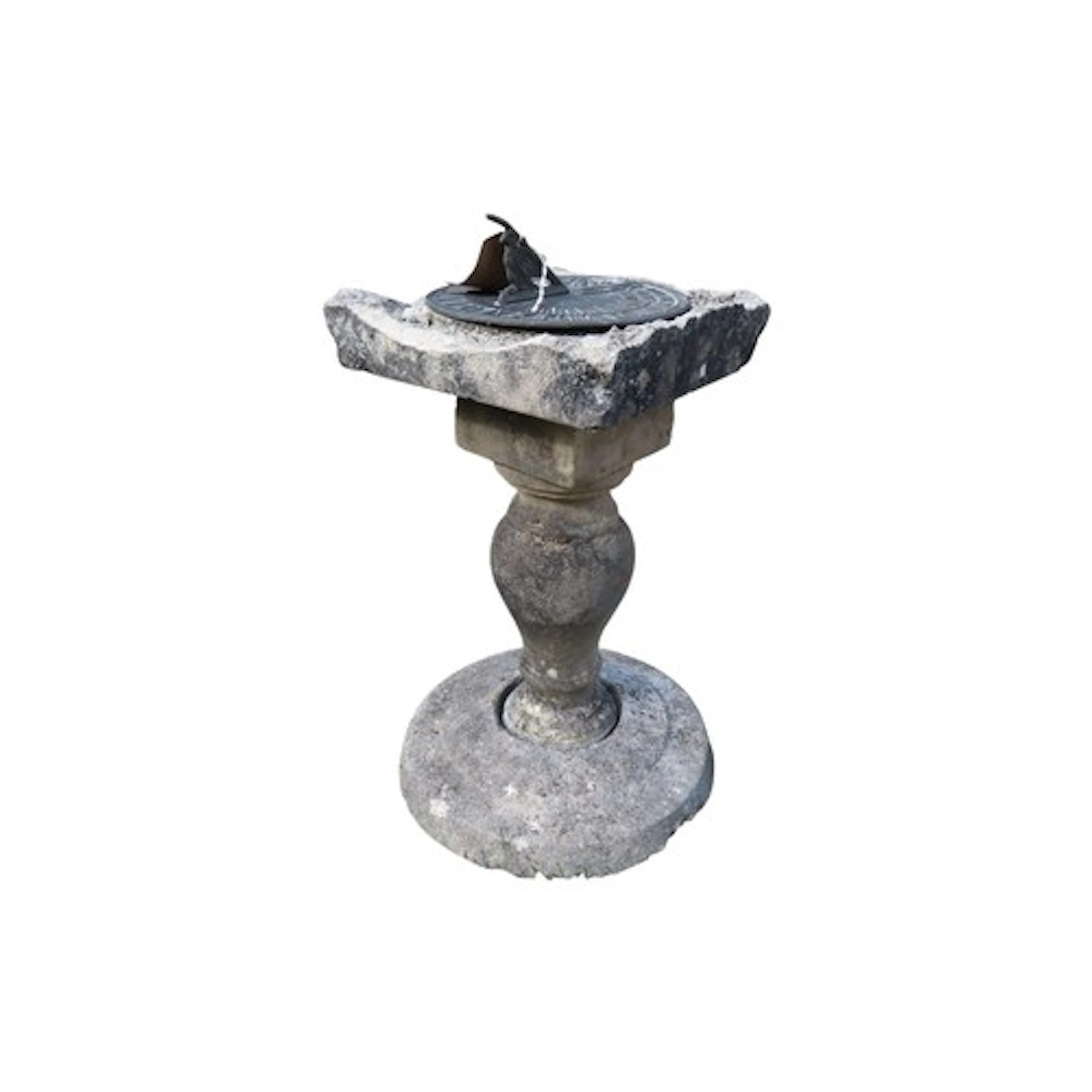 A circular cast metal sun dial raised on a weathered composi...