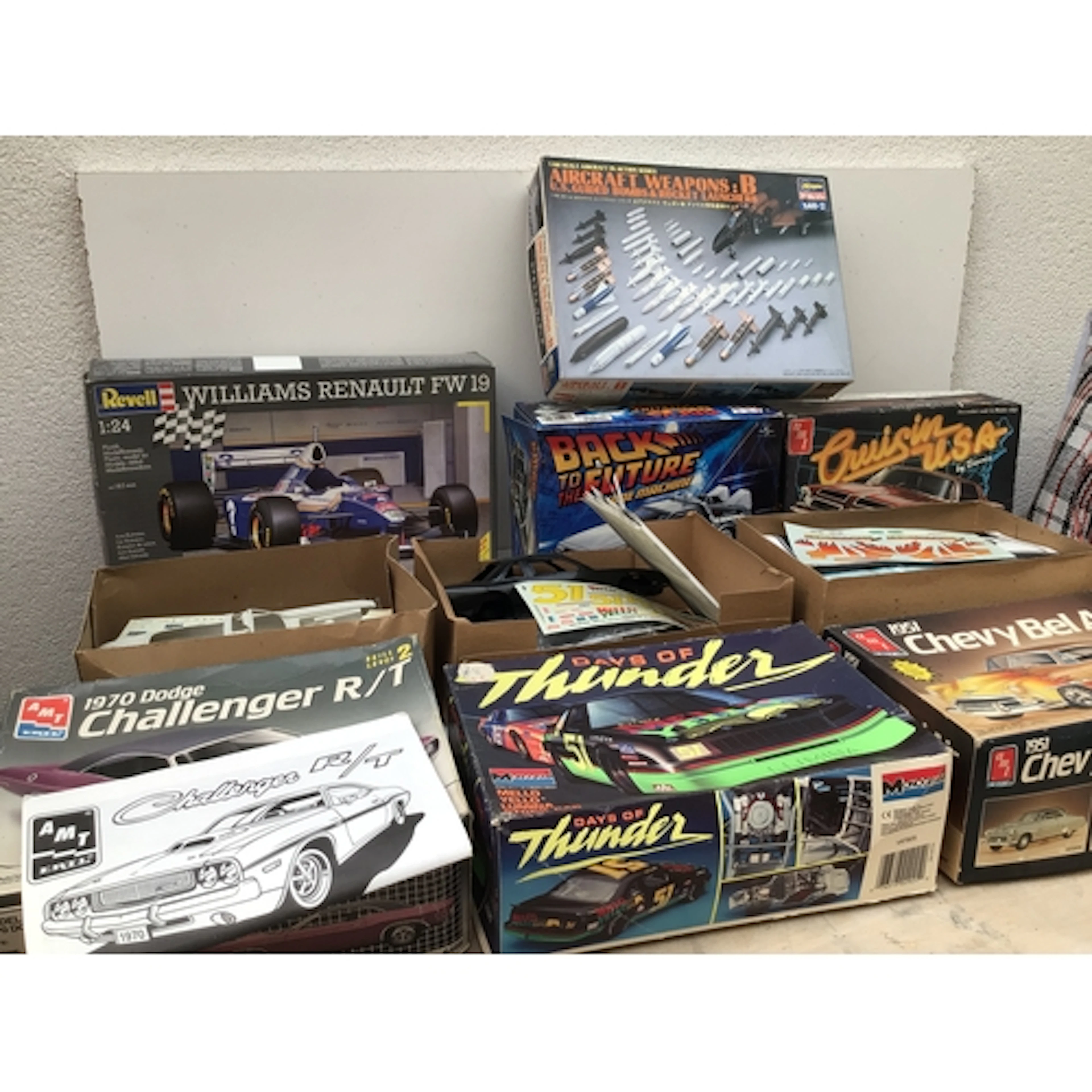 Bag containing a collection of boxed model kits by various m...