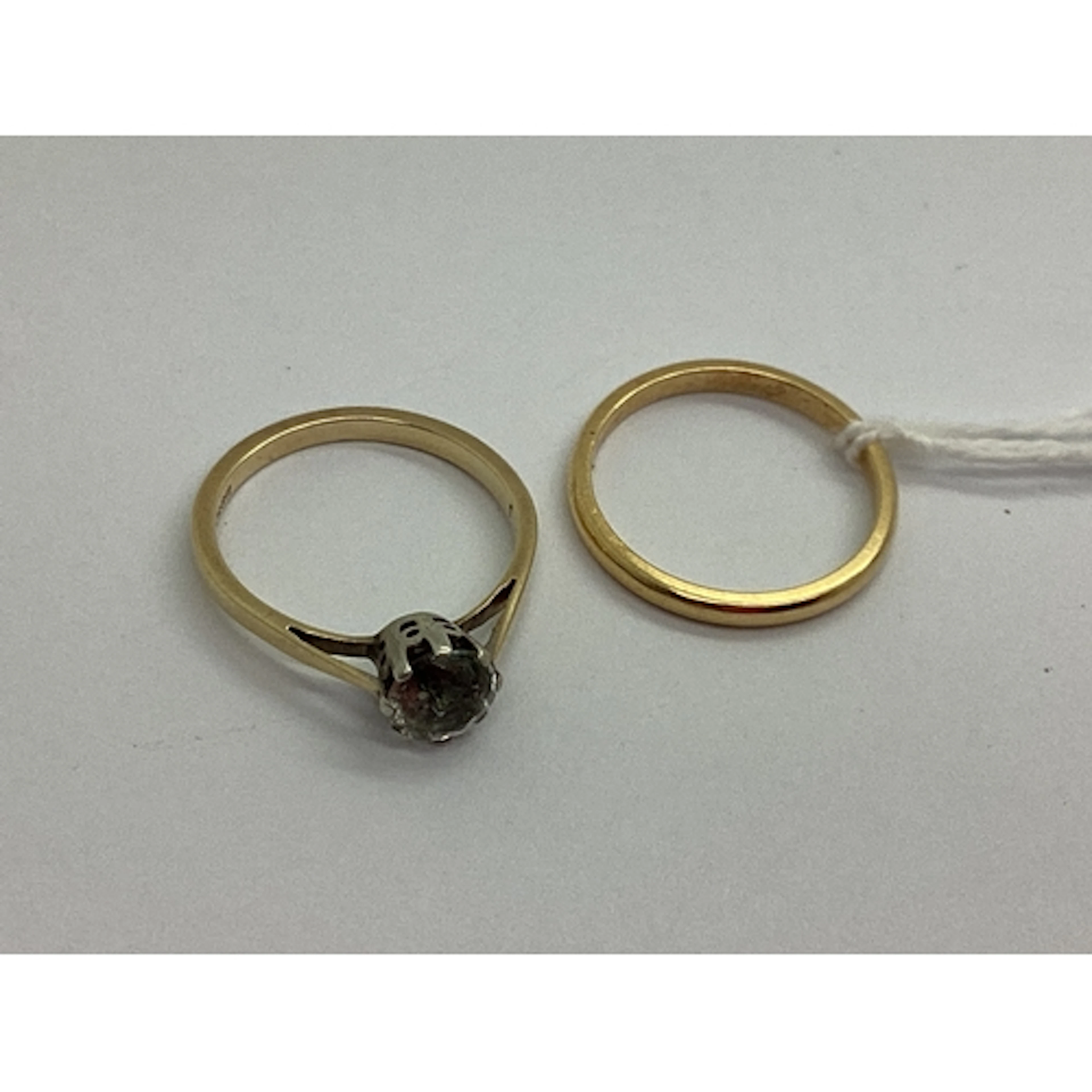 A Dainty Plain Wedding Band, stamped "18ct (finger size M); ...