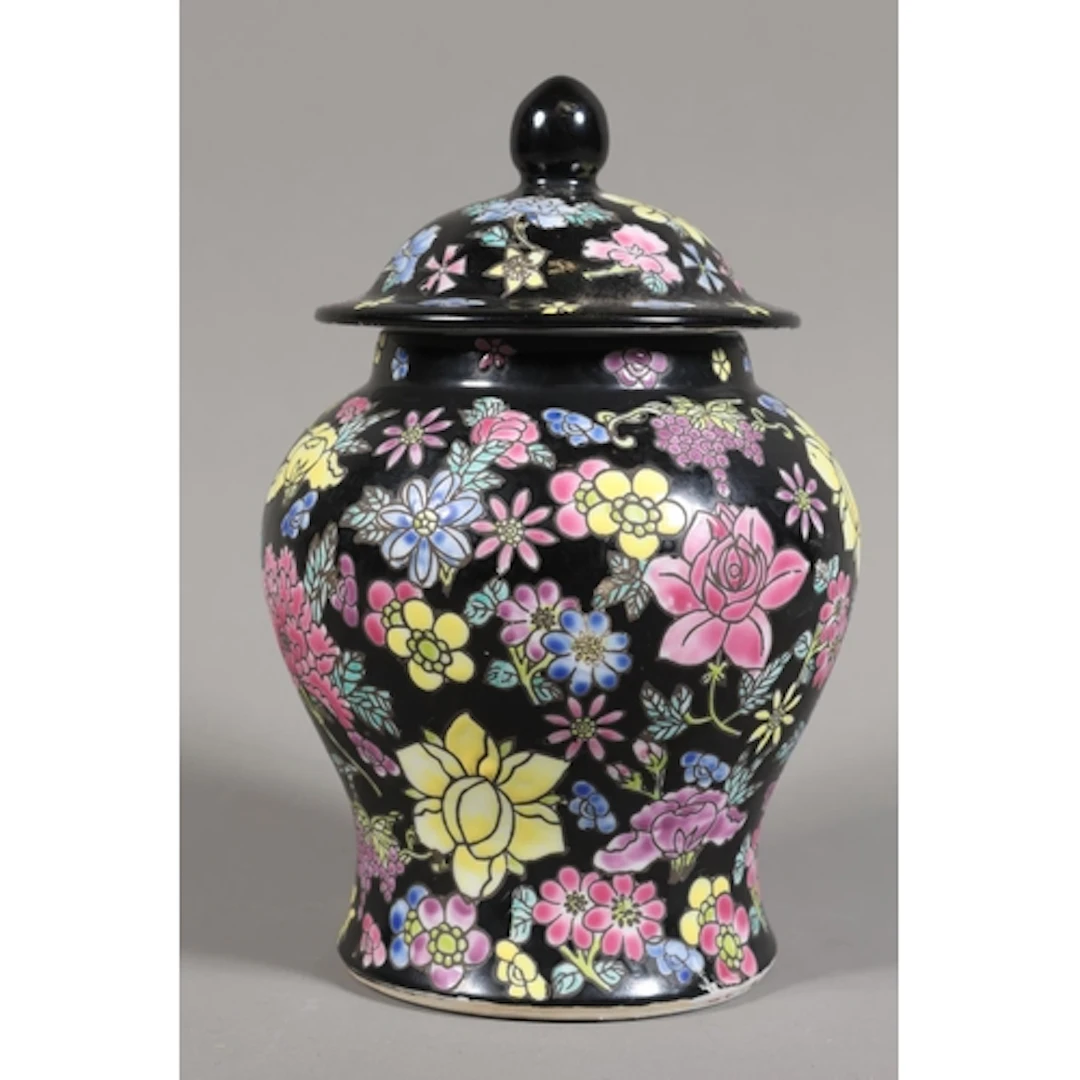 Chinese vase and cover with black ground and all-over foliat...