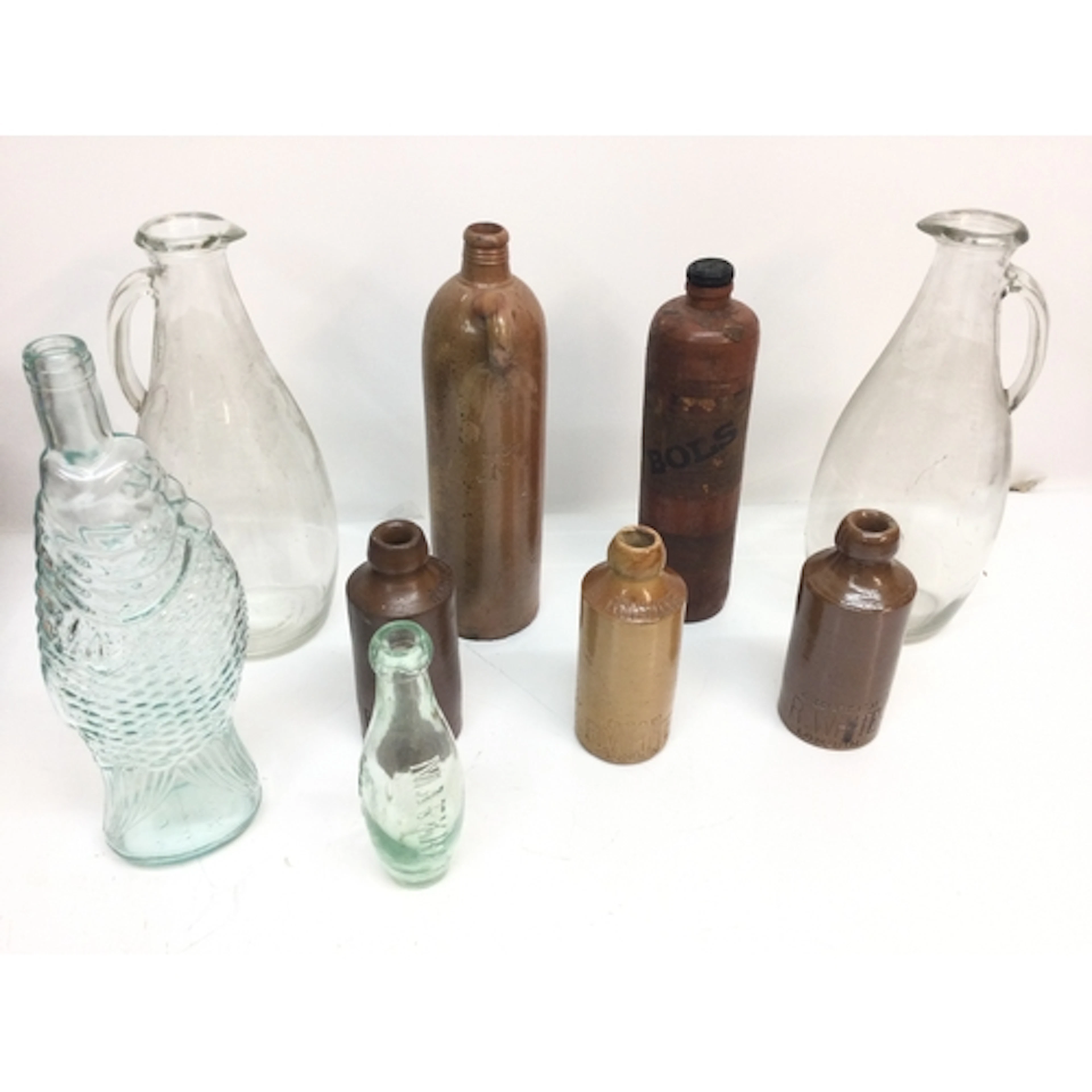 A small group of antique stoneware and glass bottles NO RESE...