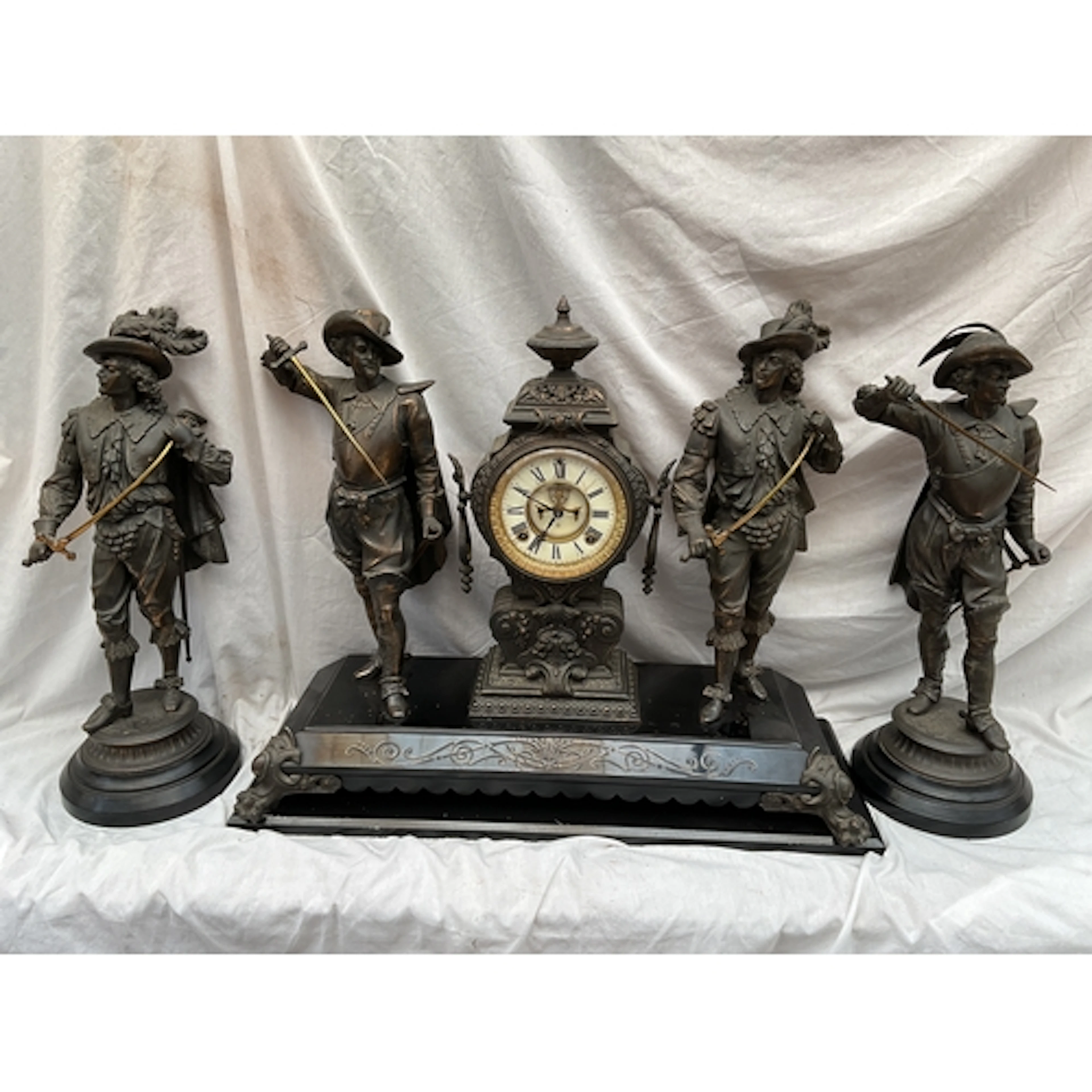 19/20th C Spelter clock garniture with Cavaliers and an Anso...