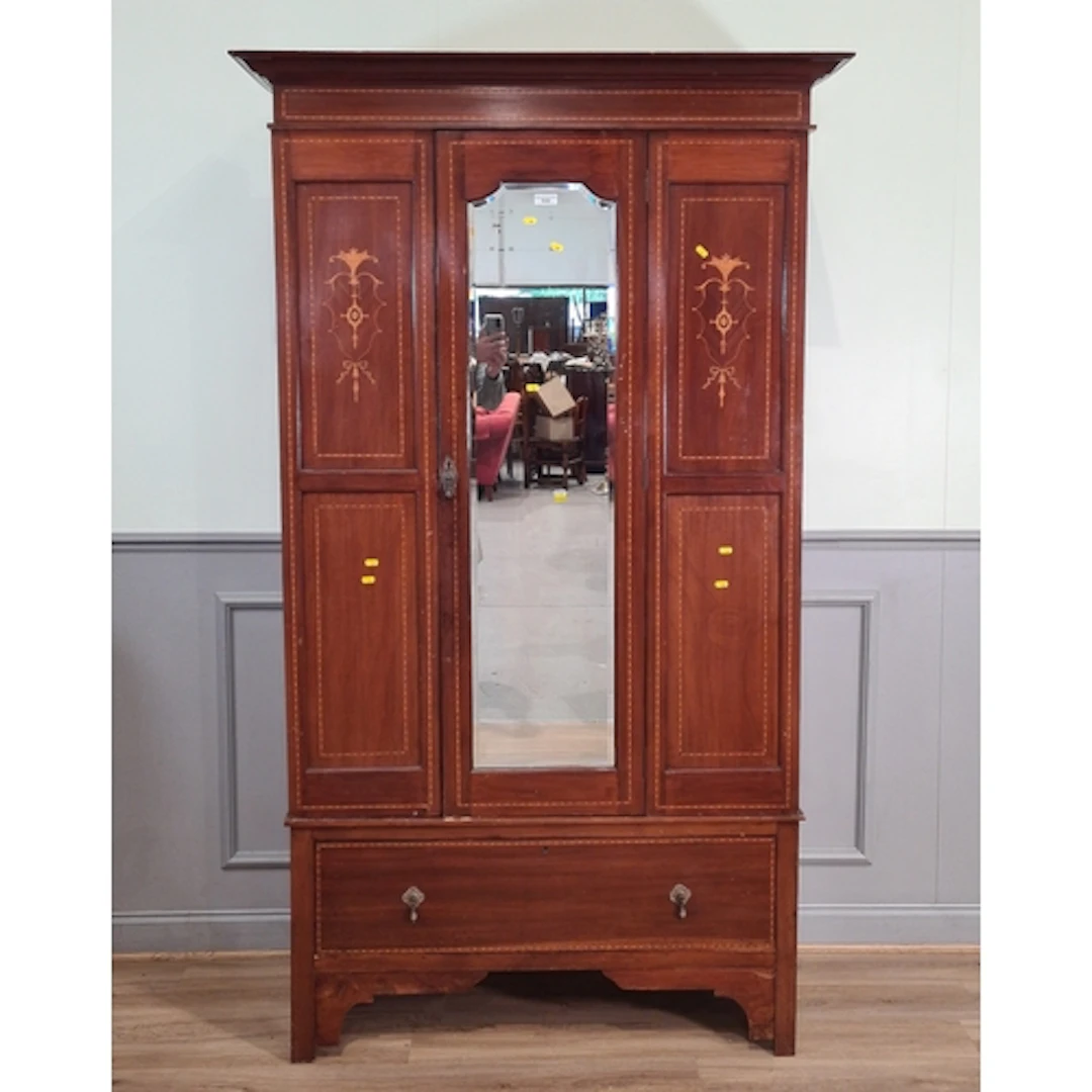 A mahogany inlaid Wardrobe fitted single mirrored door above...