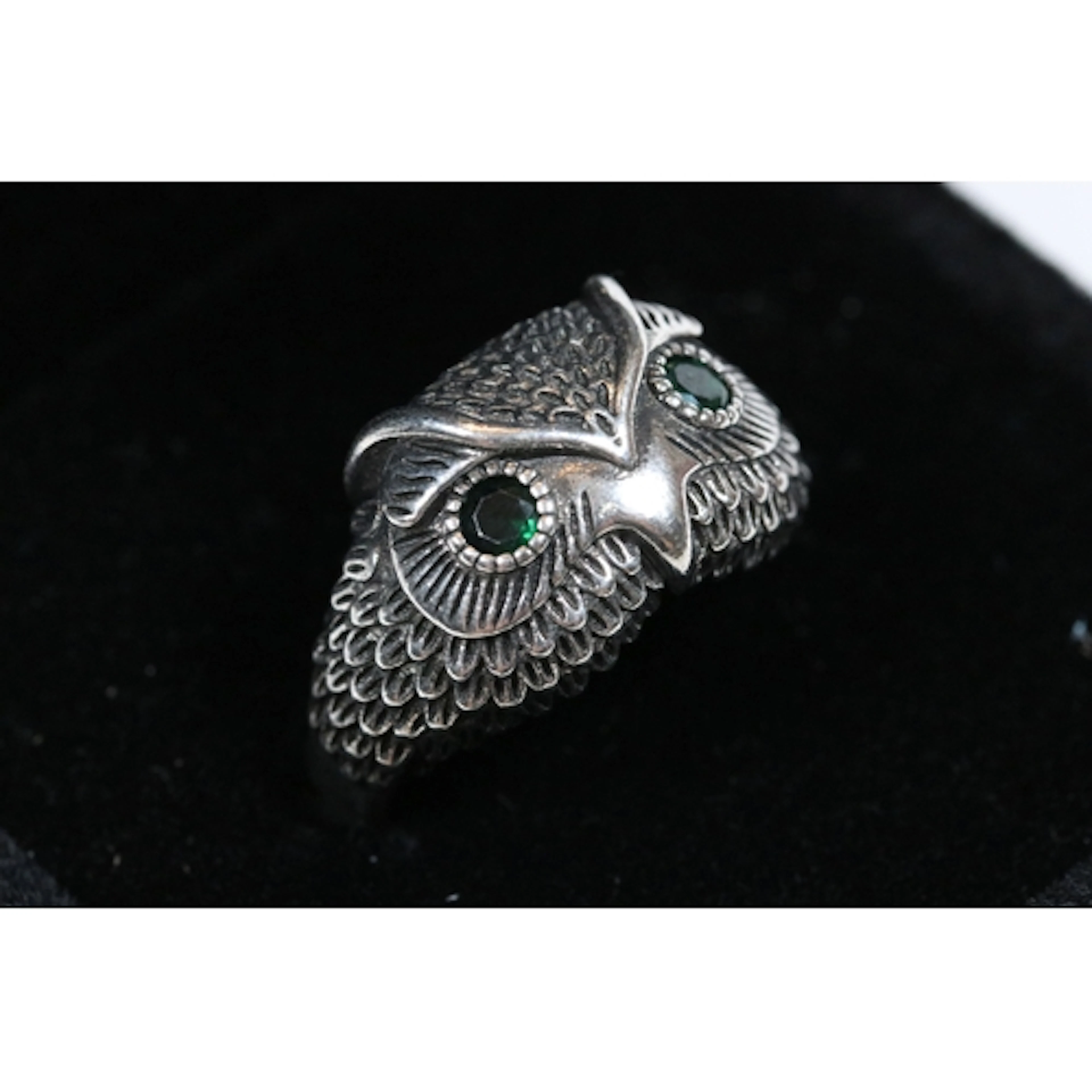 A contemporary ladies ring in the form of an owl, feather wo...