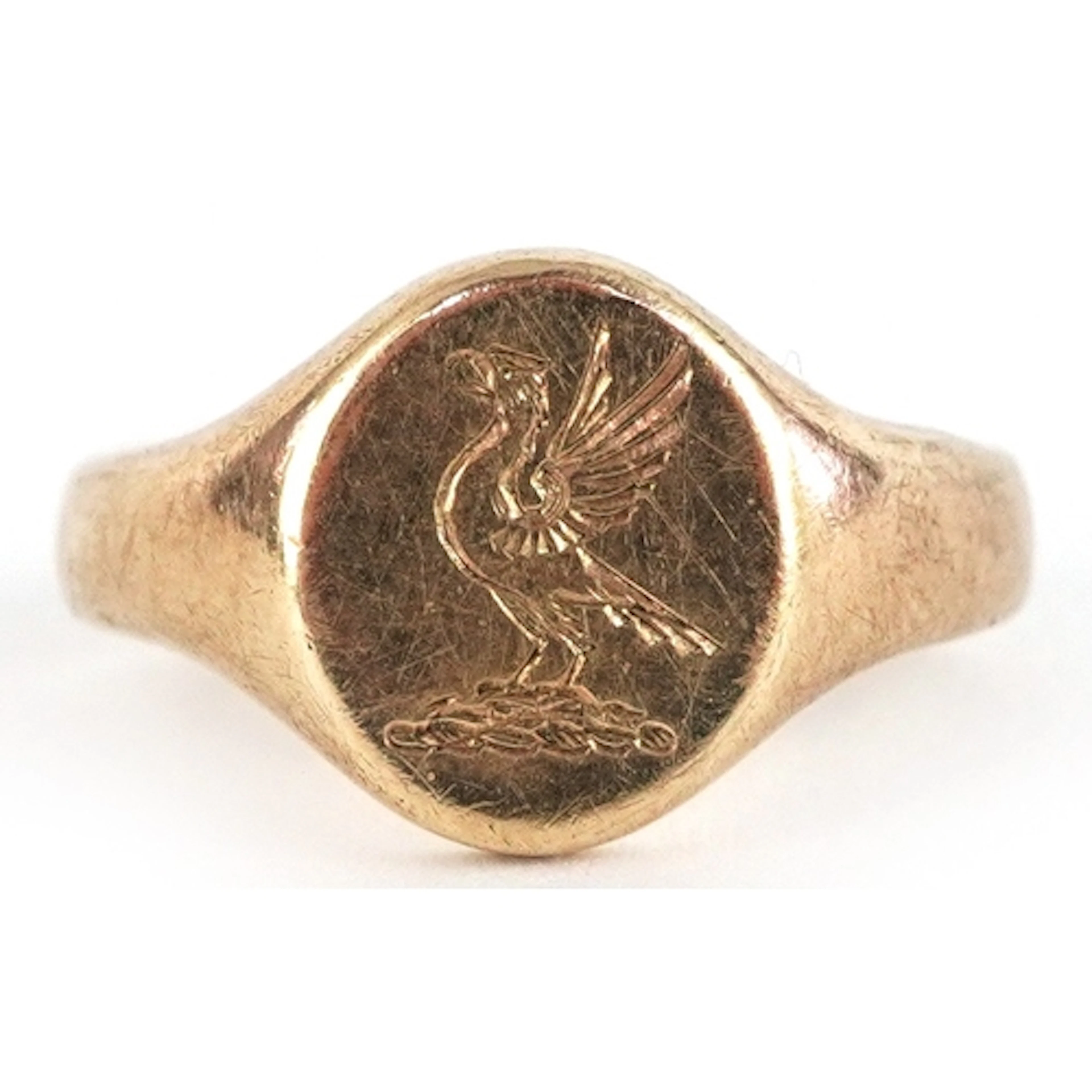 9ct gold signet ring engraved with a phoenix, size J, 5.4g.