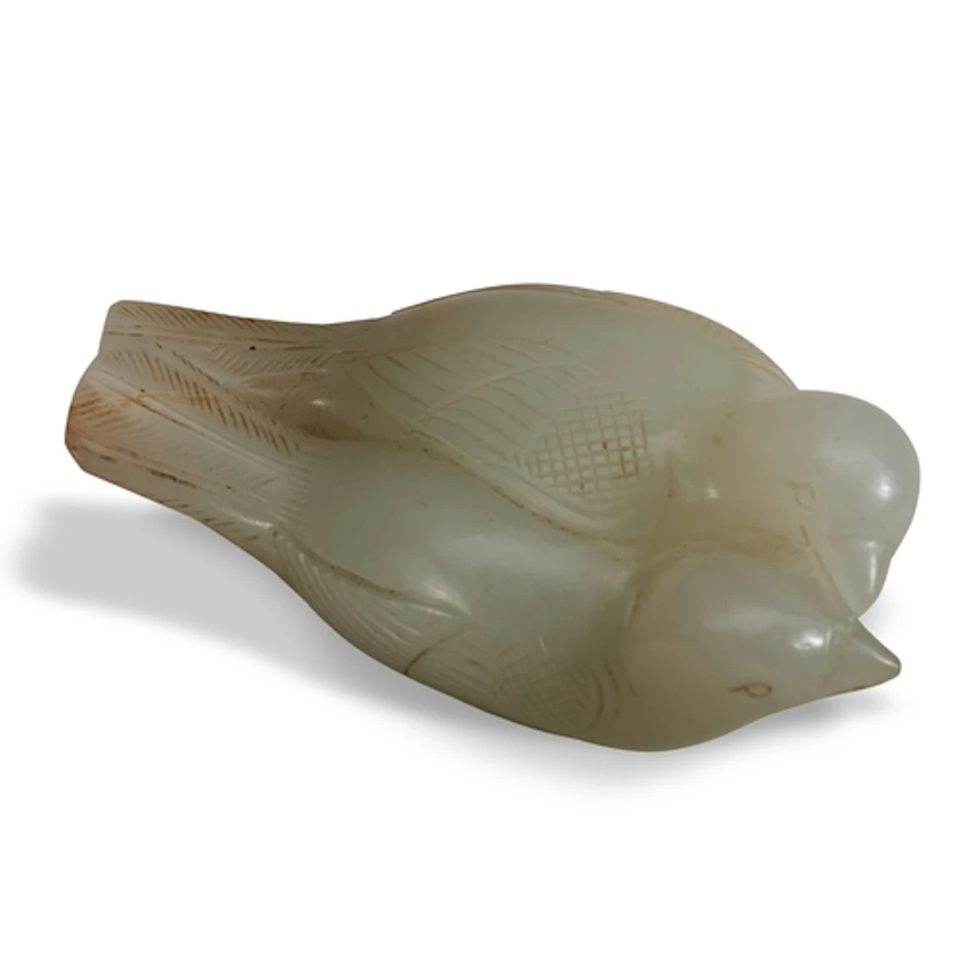 A FINE WHITE-CELADON JADE CARVING OF LOVE BIRDS SONG-MING D...