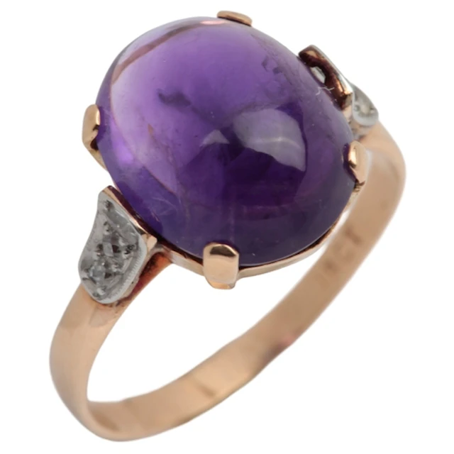 An amethyst and diamond ring, claw-set with a cabochon ameth...
