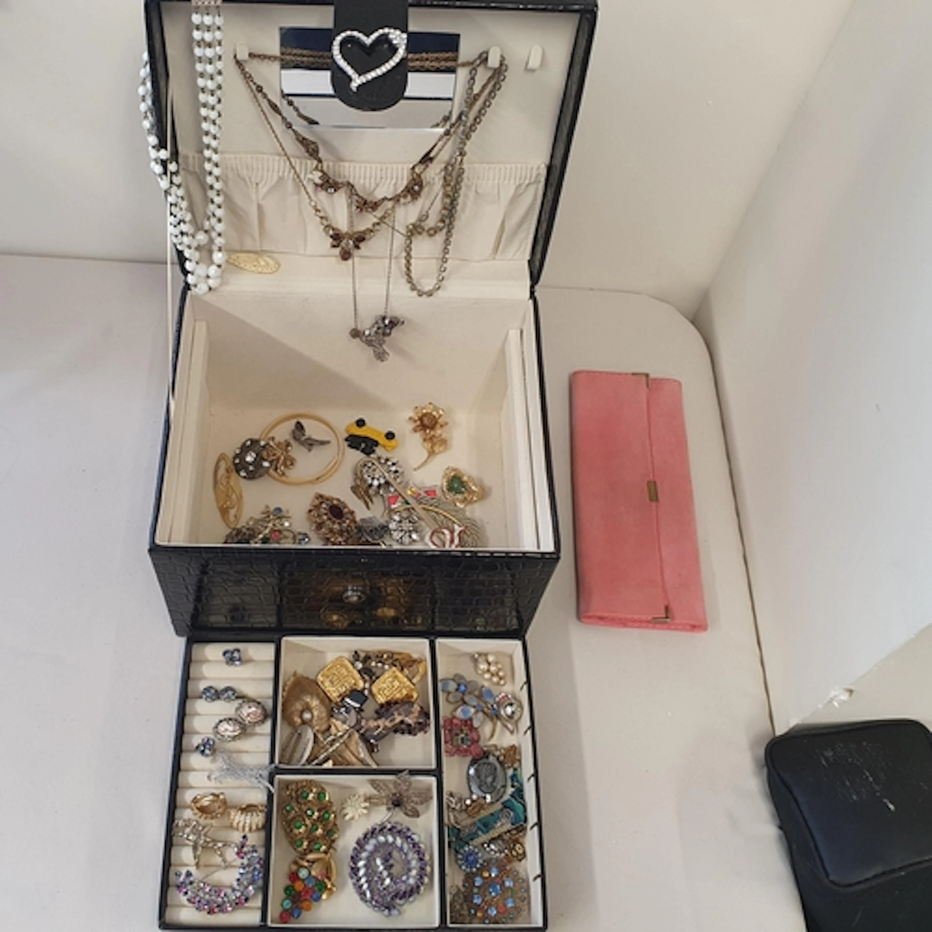 A large black patent Jewellery Box containing Costume Jewell...