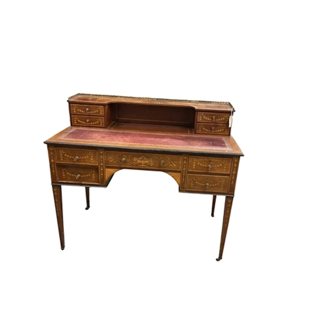 An Edwardian mahogany and marquetry inlaid kneehole desk, wi...