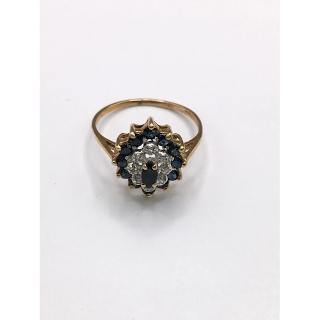 A 9ct gold cluster ring set with small sapphires and diamond...