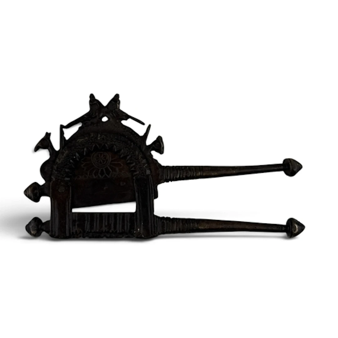 A 19TH CENTURY OR EARLIER BETEL CRUSHER 20cm x 10cm...