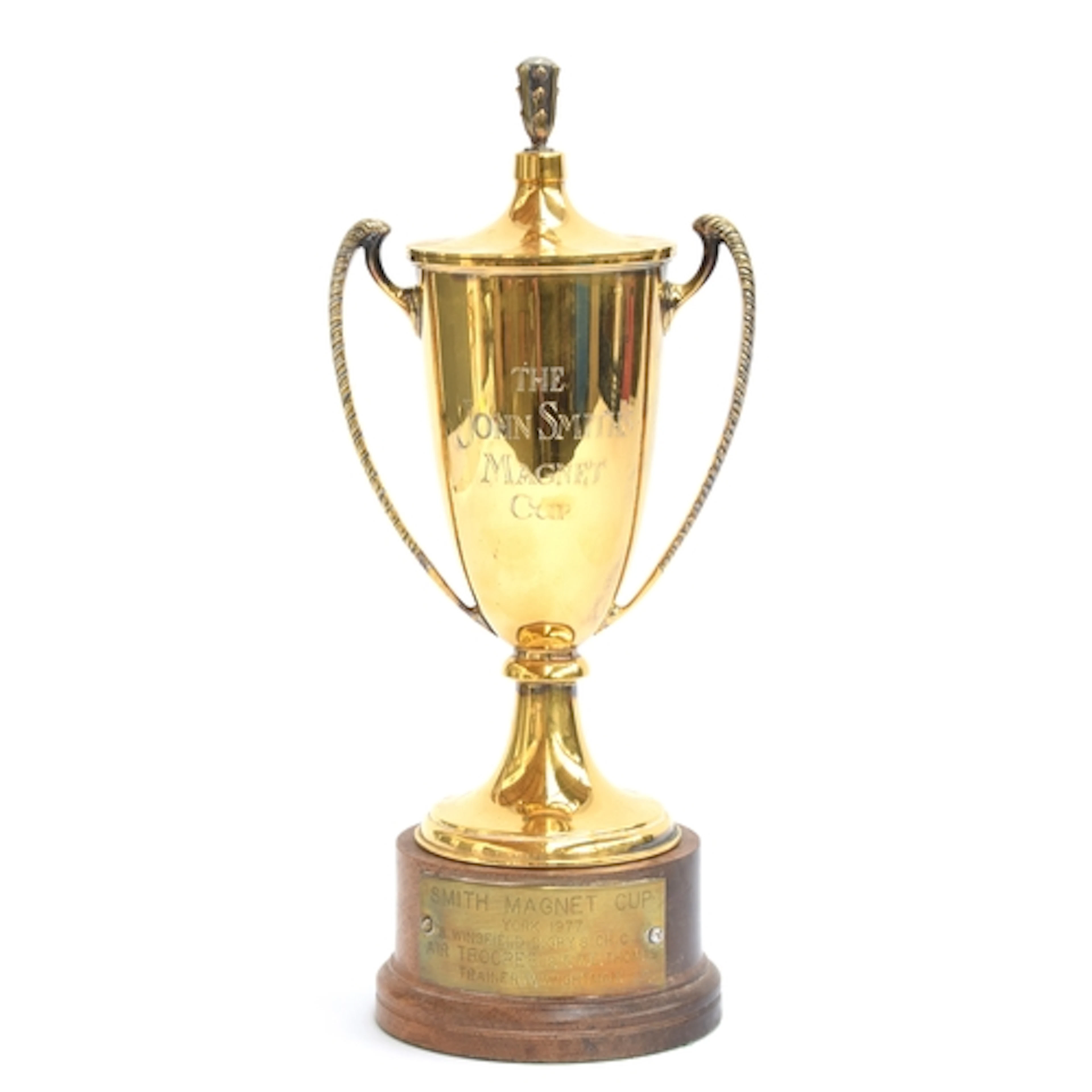 A silver gilt twin handled trophy cup and cover by C J Vande...