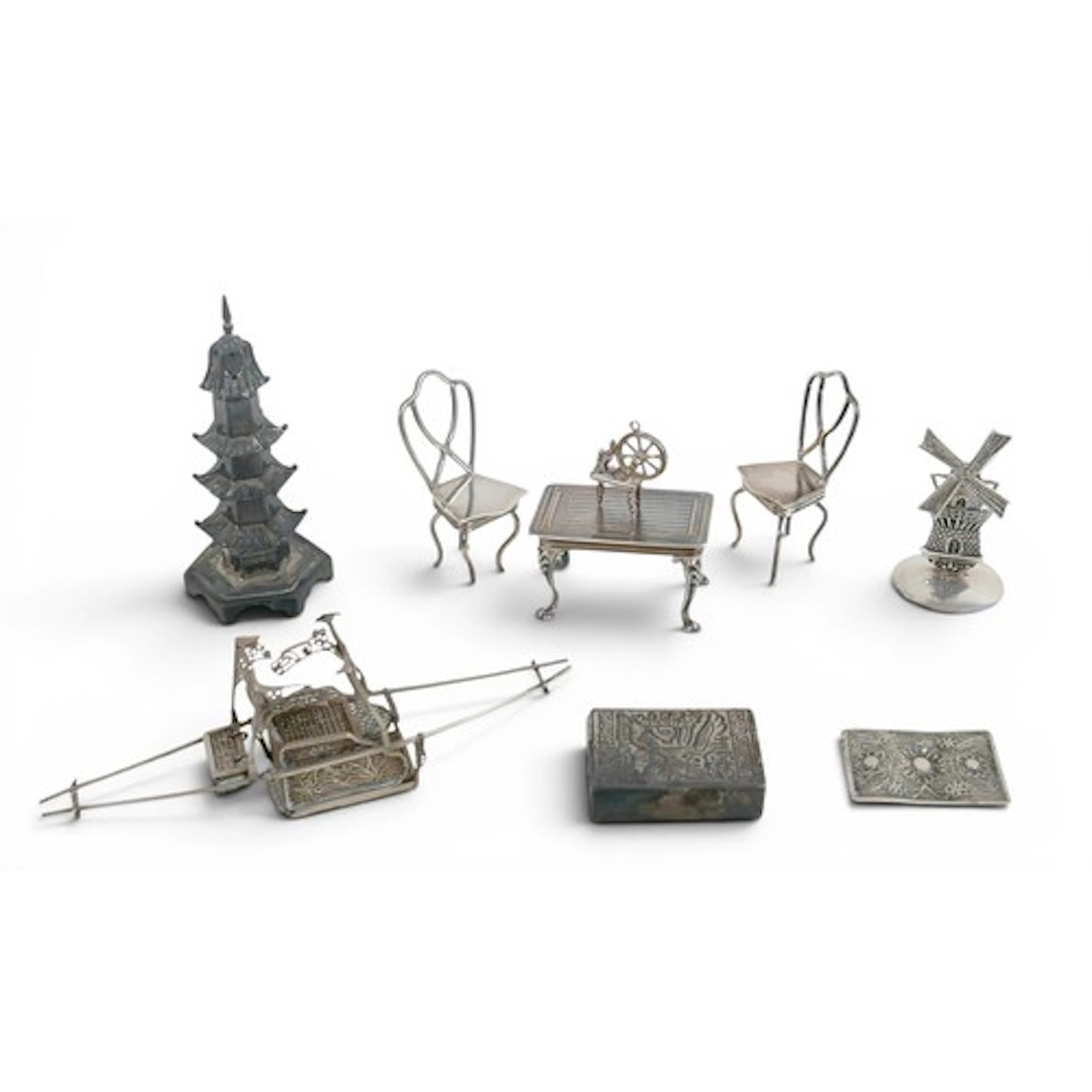A quantity of small silver and silver metal miniature models...