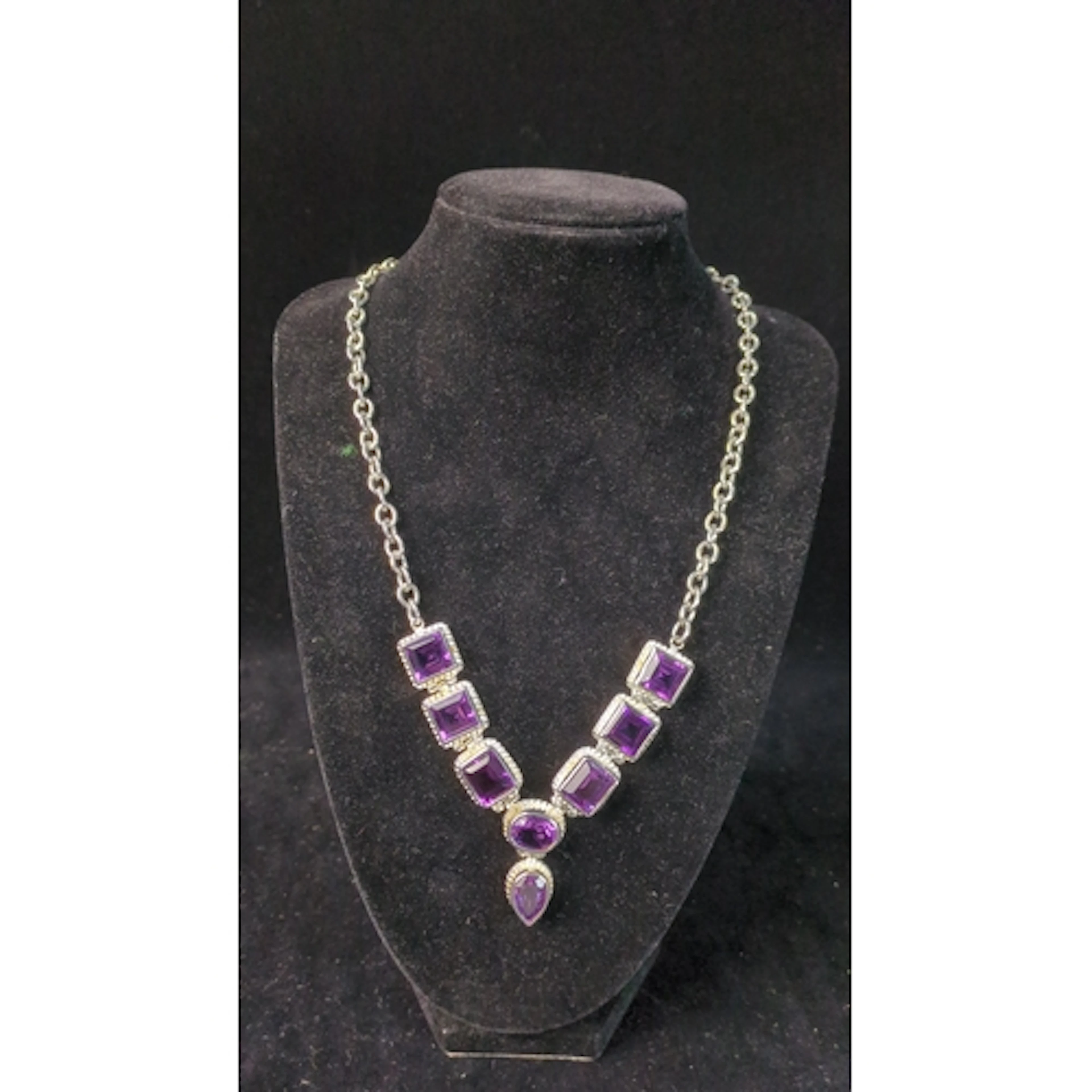 Sterling silver necklace set with square-cut purple stones, ...