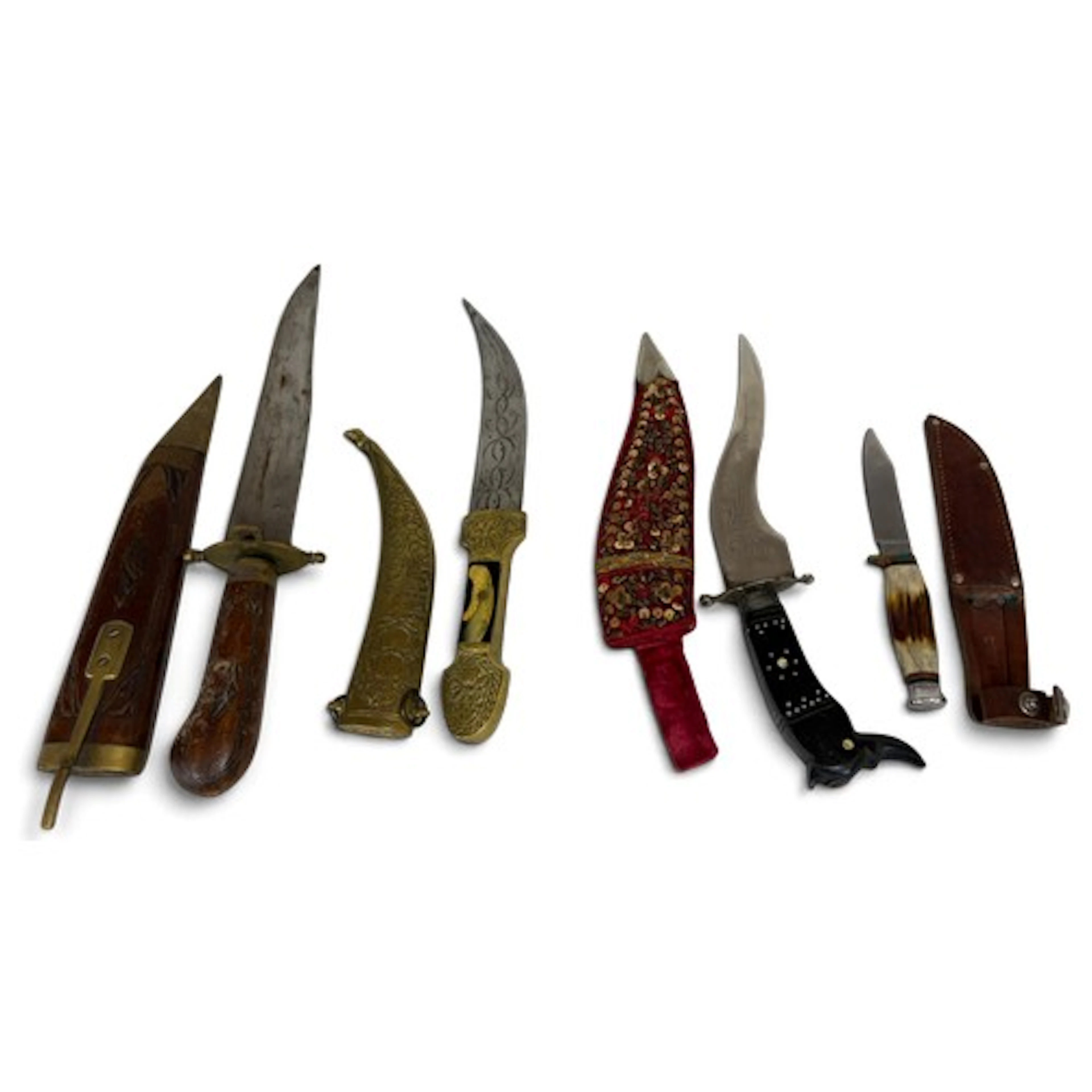 Three daggers to include Jambiya dagger with dome shaped pom...