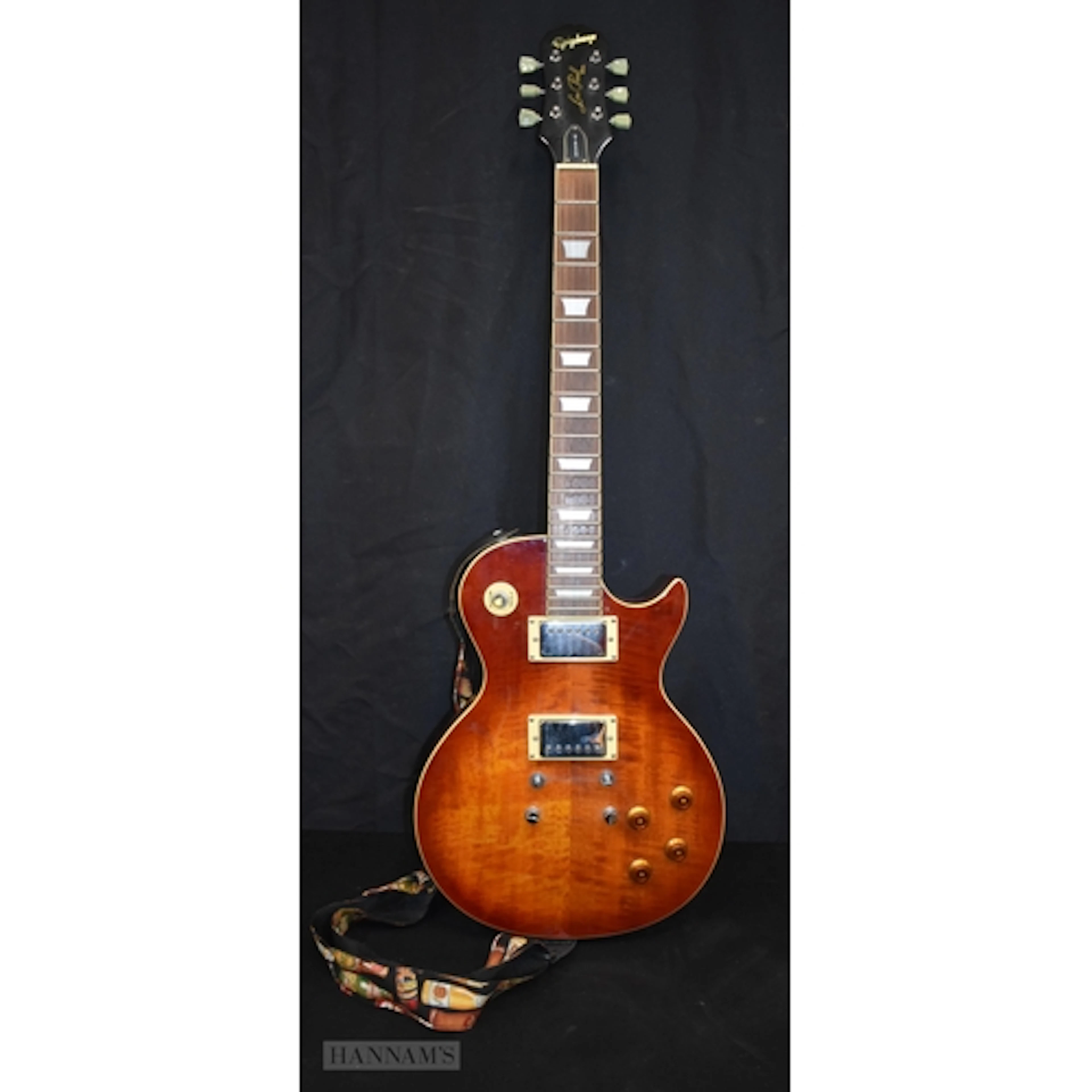 An Epiphone Les Paul electric guitar with soft case 99cm