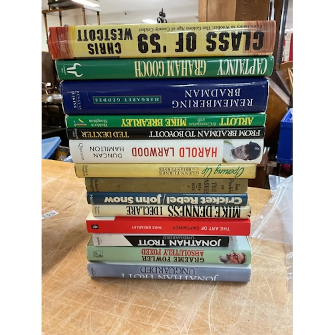 Cricket books to include signed Graham Gooch example.