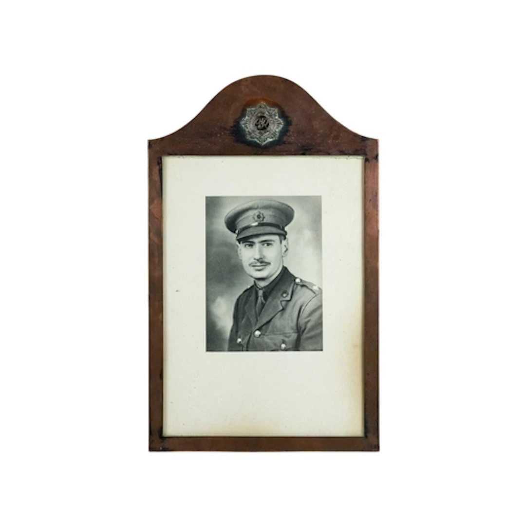 A WWII copper frame. The top inset with a Royal Army Service...