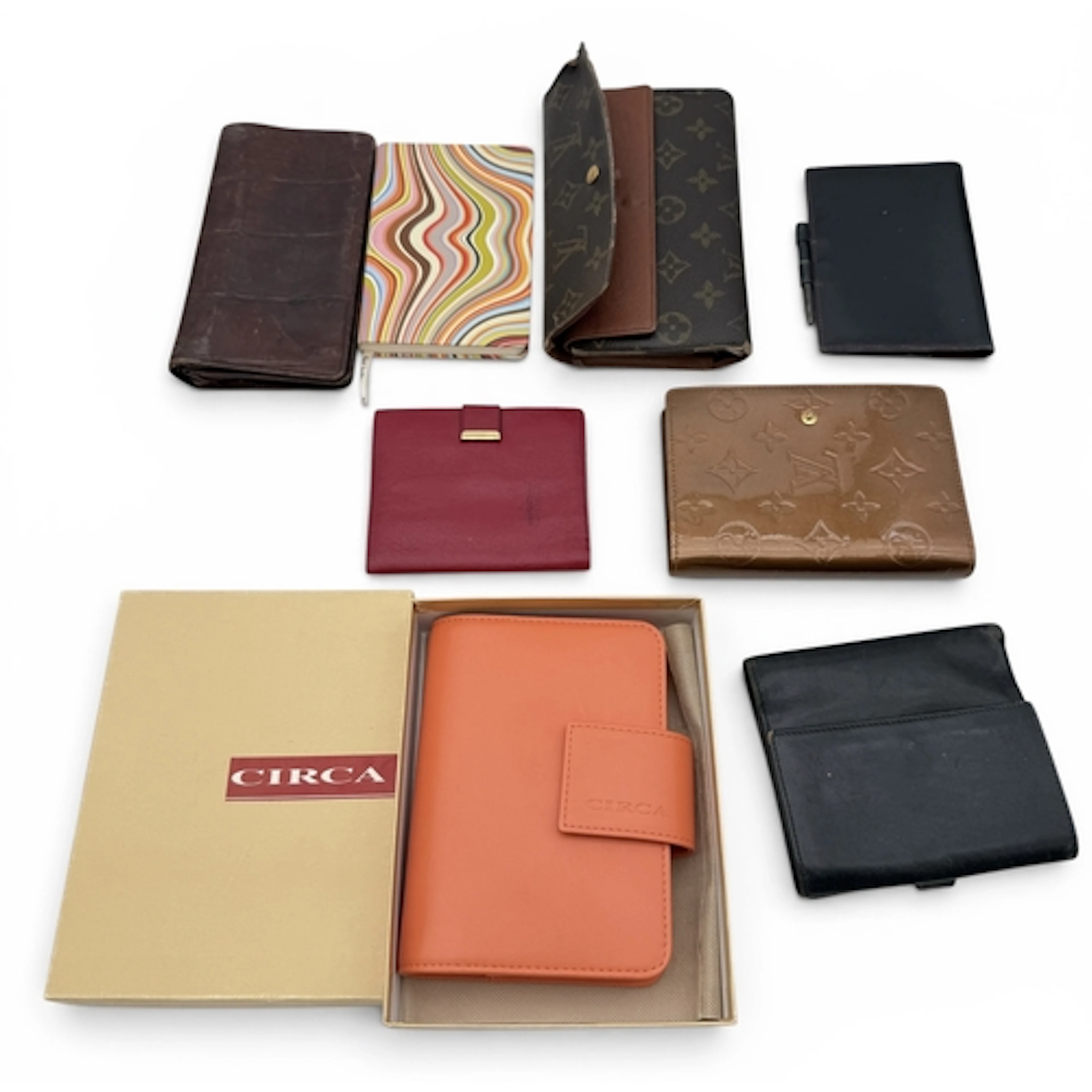 A GROUP OF DESIGNER PURSES AND NOTEBOOKS To include items by...