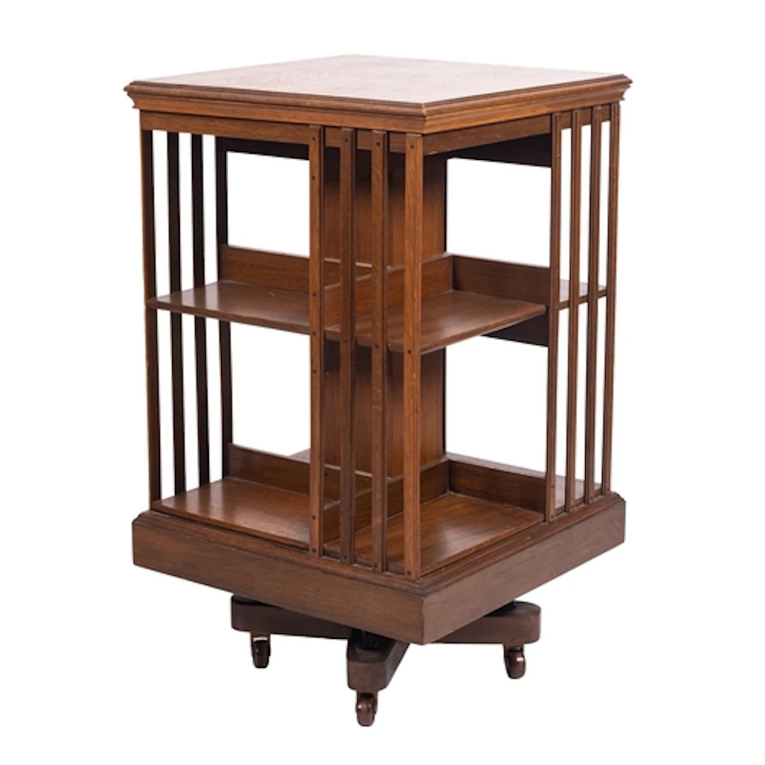 A Victorian oak revolving bookcase, late 19th century; the t...