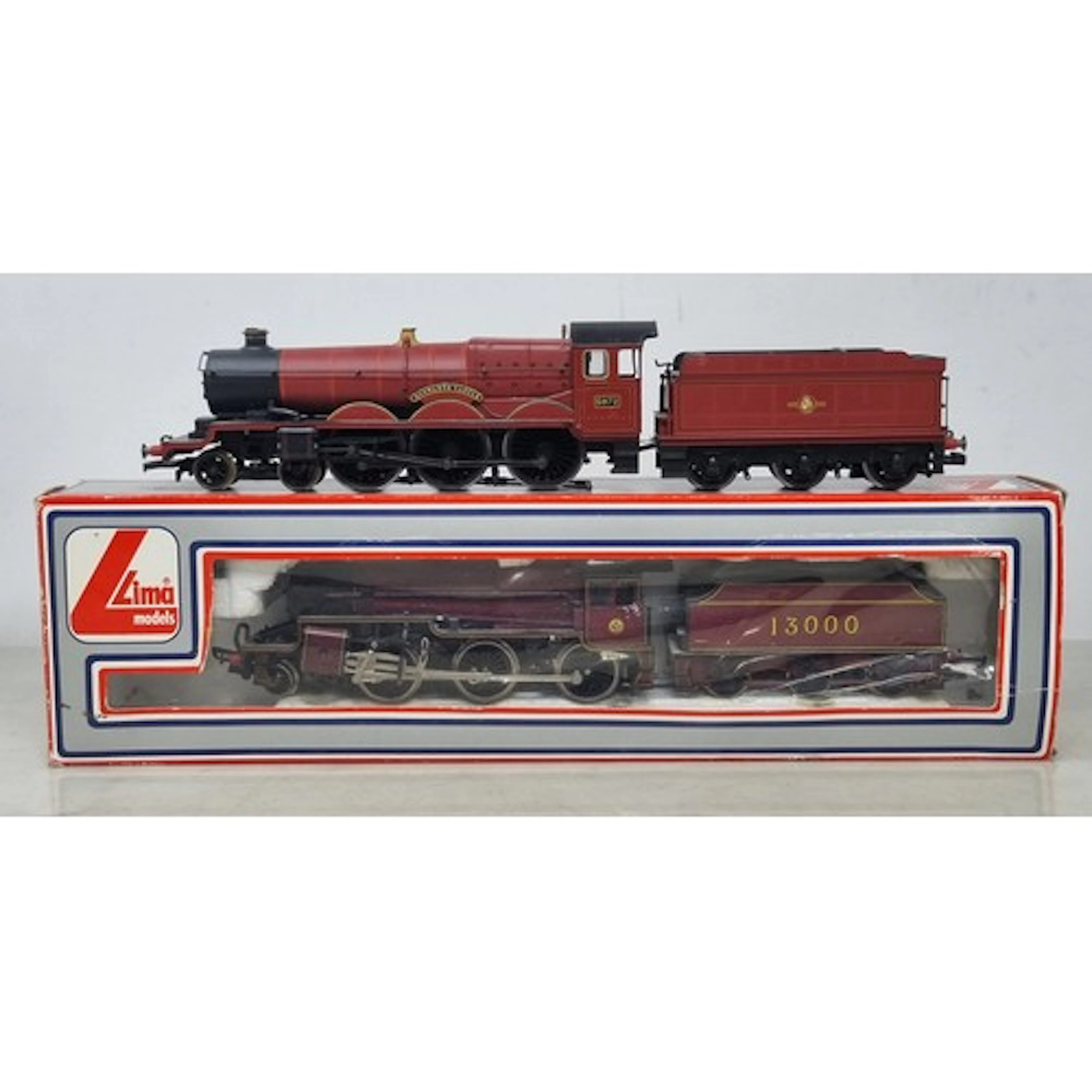A boxed Lima 00 gauge 2-6-0 'Mogul' in LMS maroon livery, an...