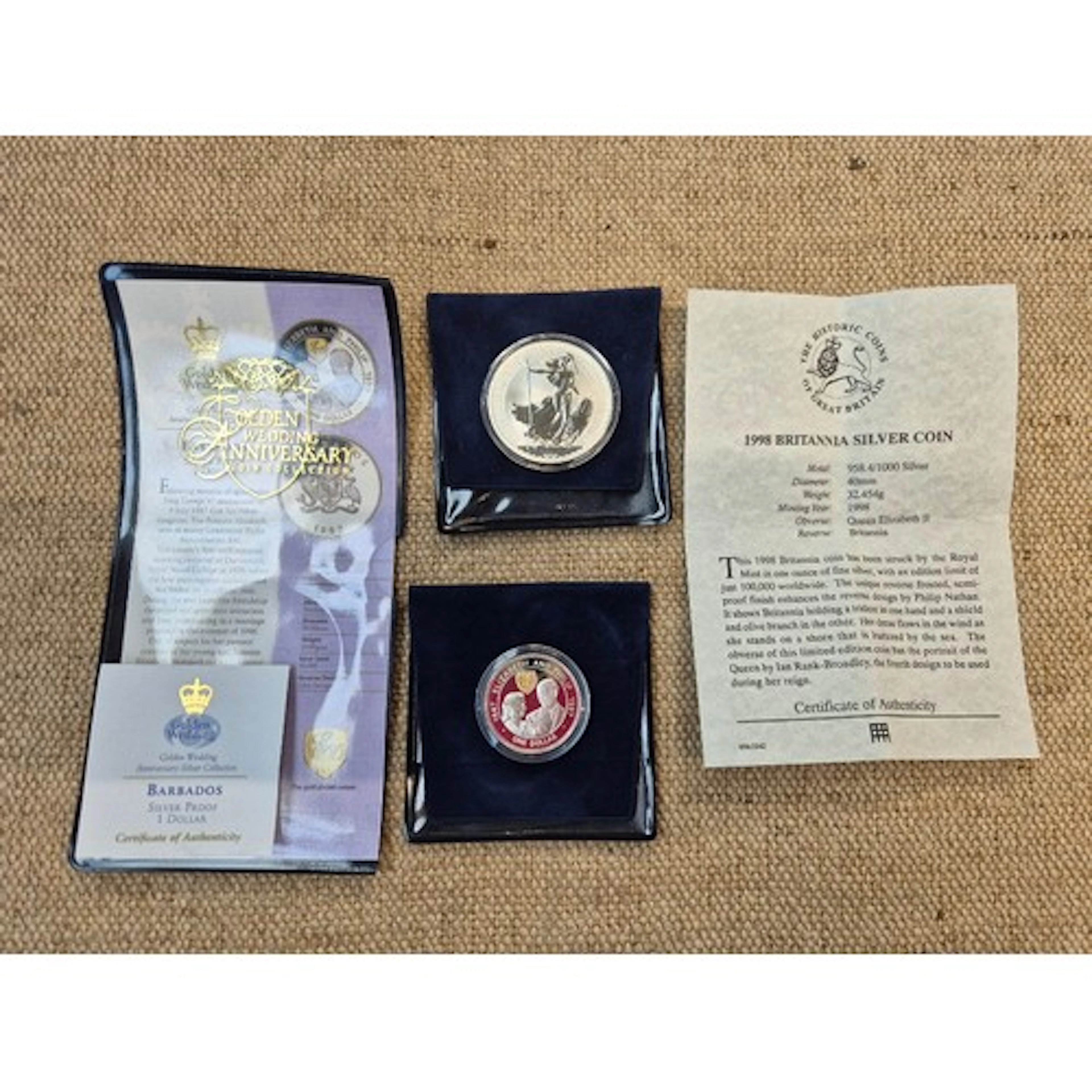 Two silver commemorative coins comprising of a 1997 golden w...