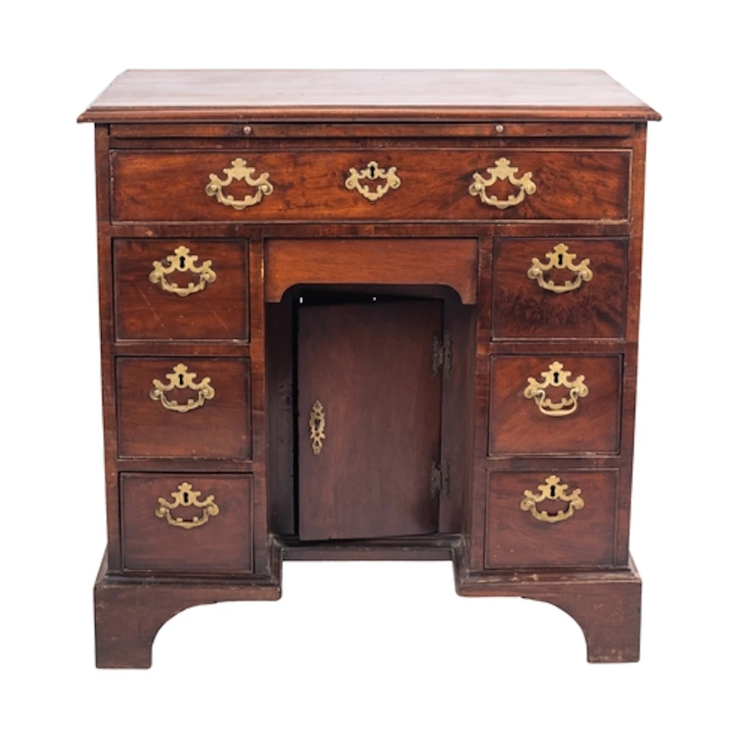 A George III mahogany kneehole desk, circa 1770; the top wit...