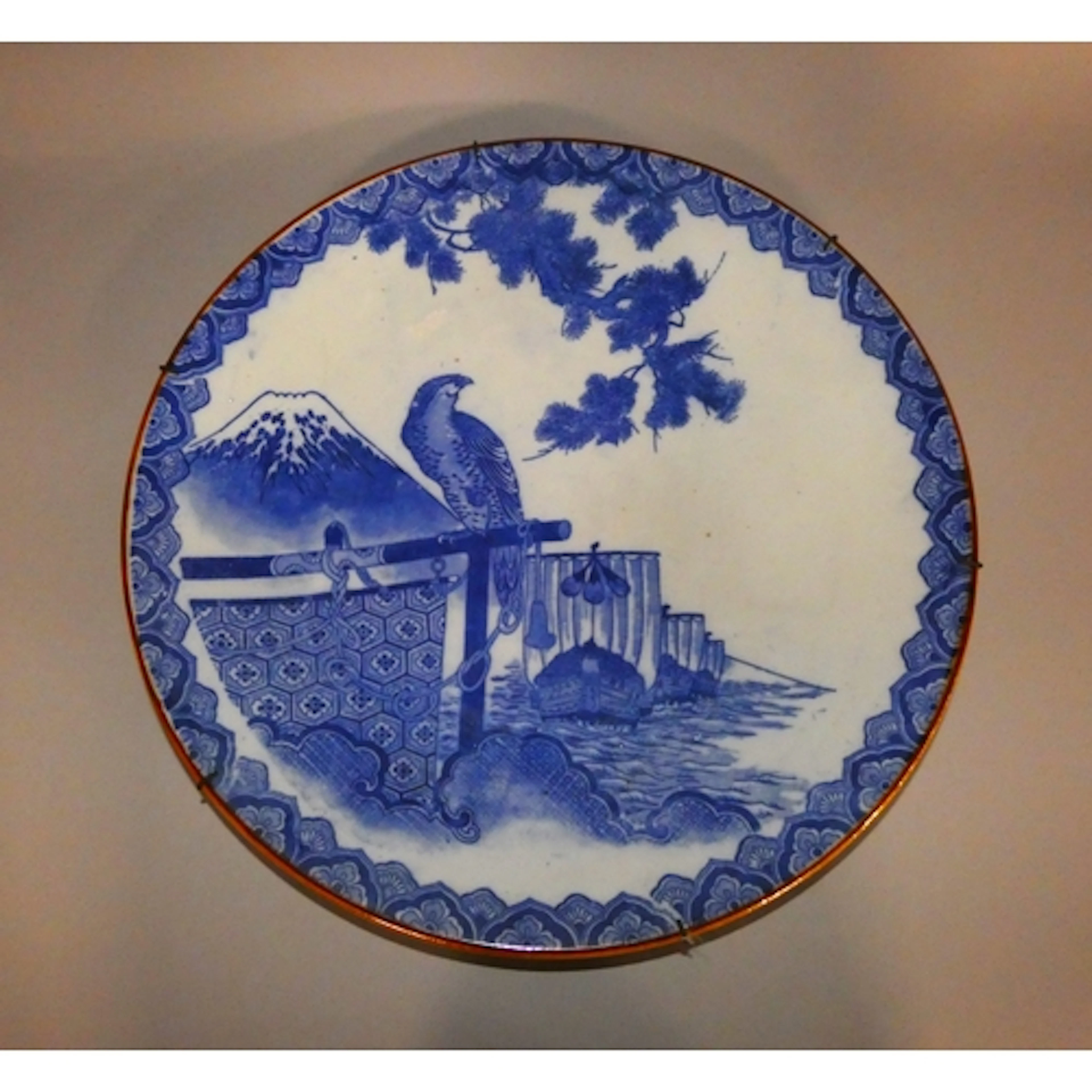 Japanese Arita blue and white pottery circular charger, Meij...