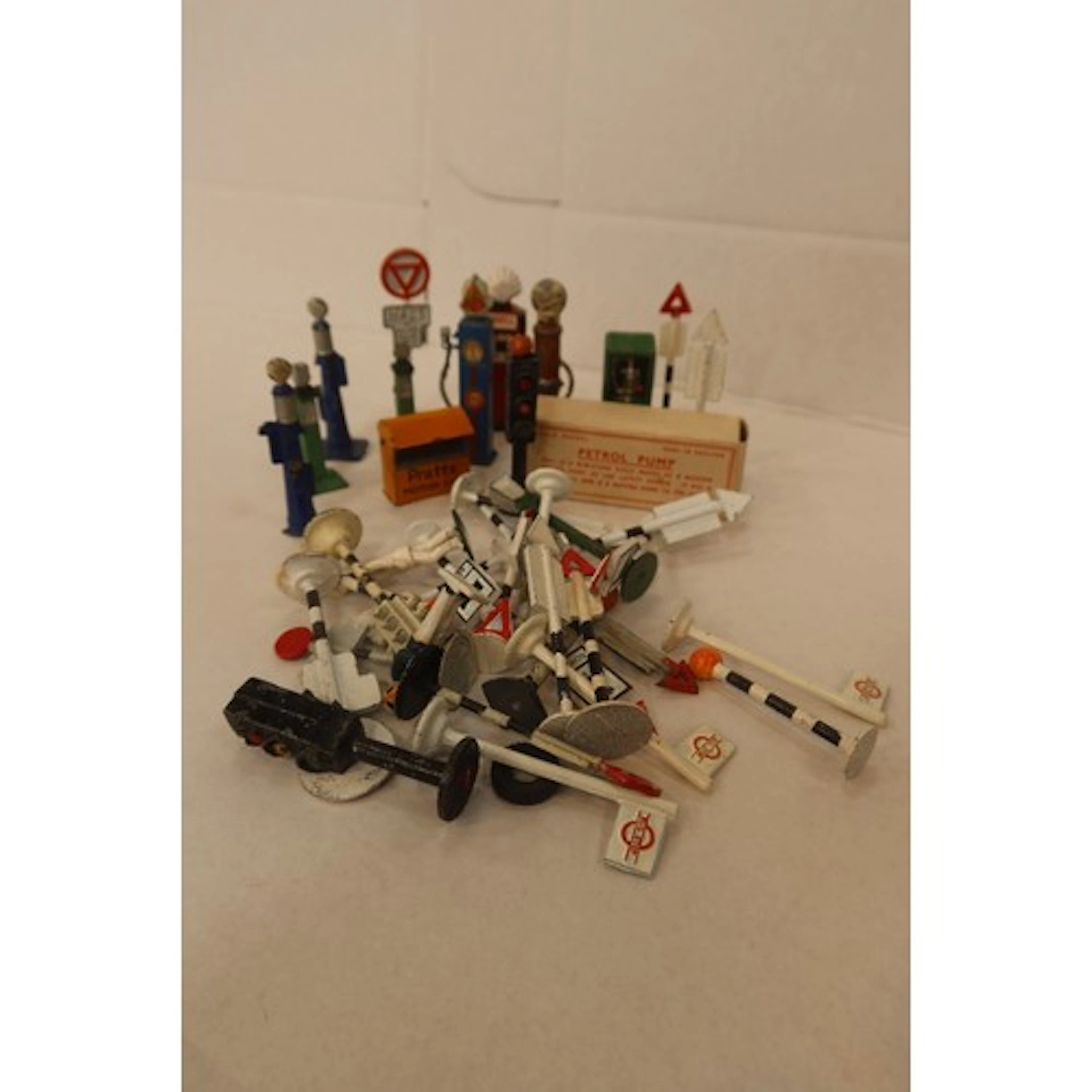 Quantity Dinky and other road signs, petrol pumps etc