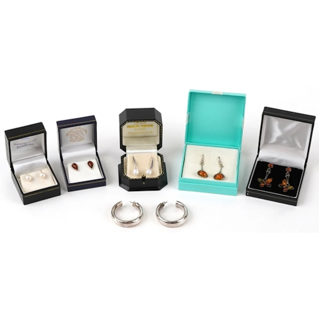 Six pairs of silver earrings including cultured pearls, Gyps...