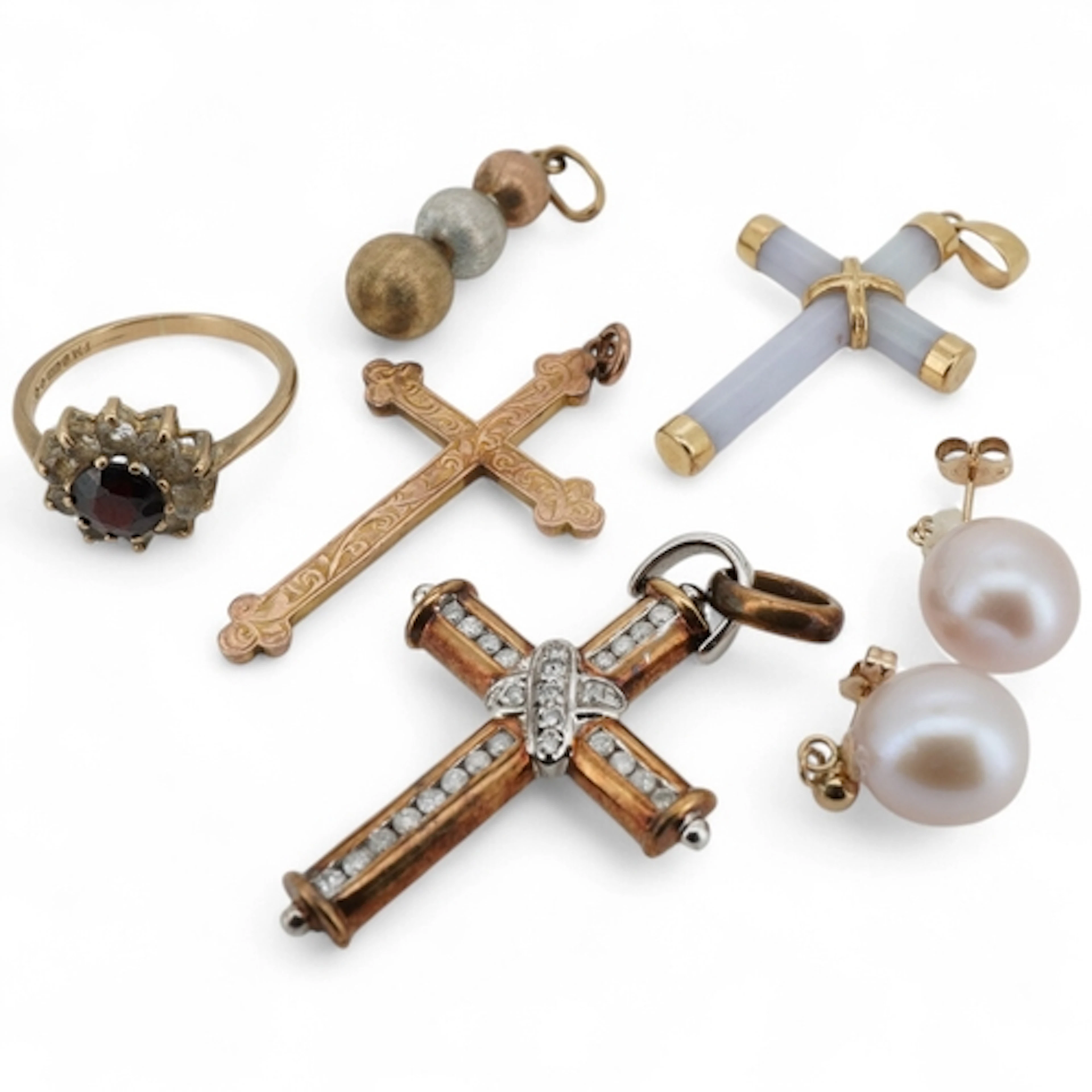 A collection of jewels, comprising: a diamond cross pendant ...