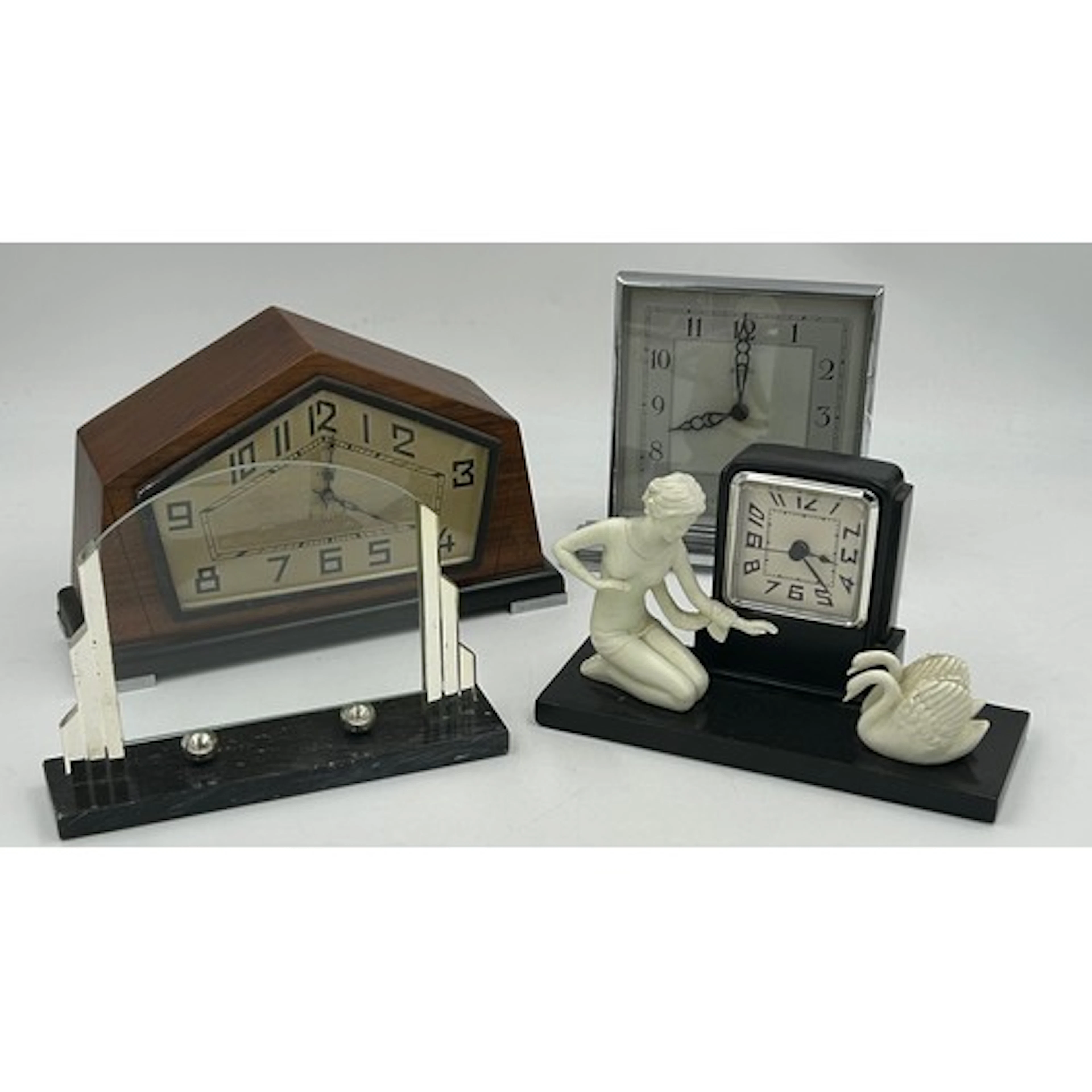 Two Art Deco clocks to include a walnut cased 8 day mantel c...