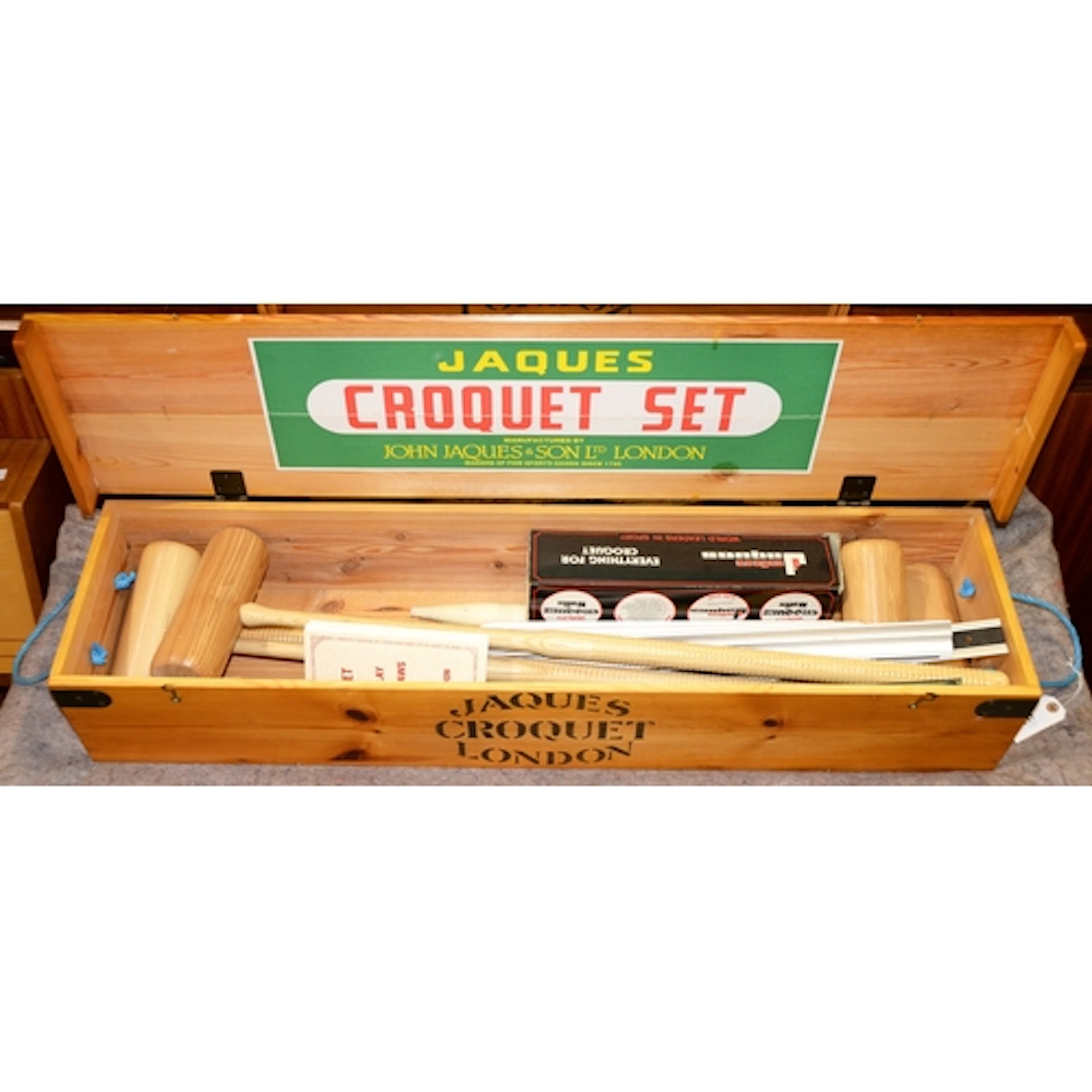 A Jaques garden croquet set, in original stained pine trunk,...
