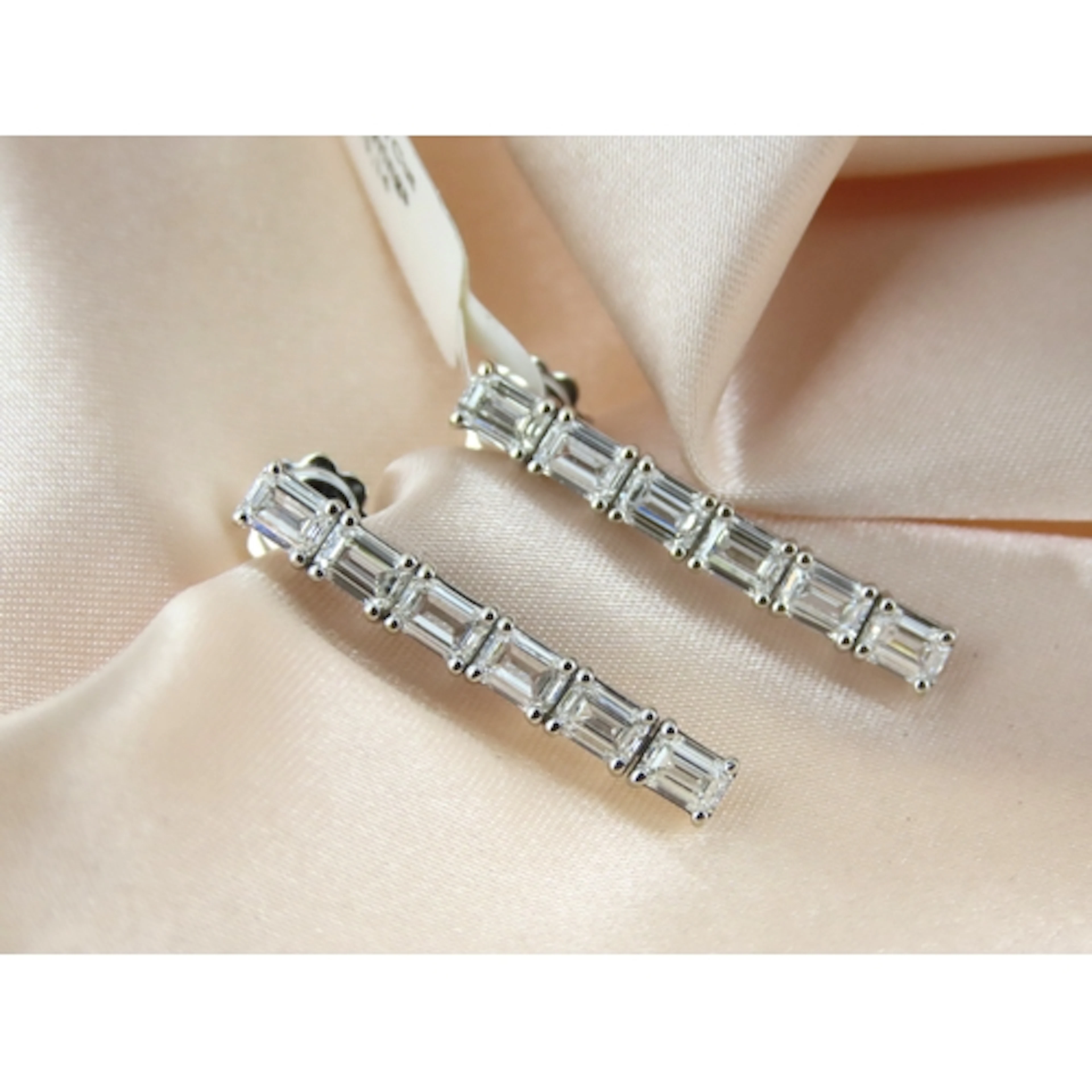Pair of Emerald Cut Diamond Six Stone Set Drop Earrings, Mou...