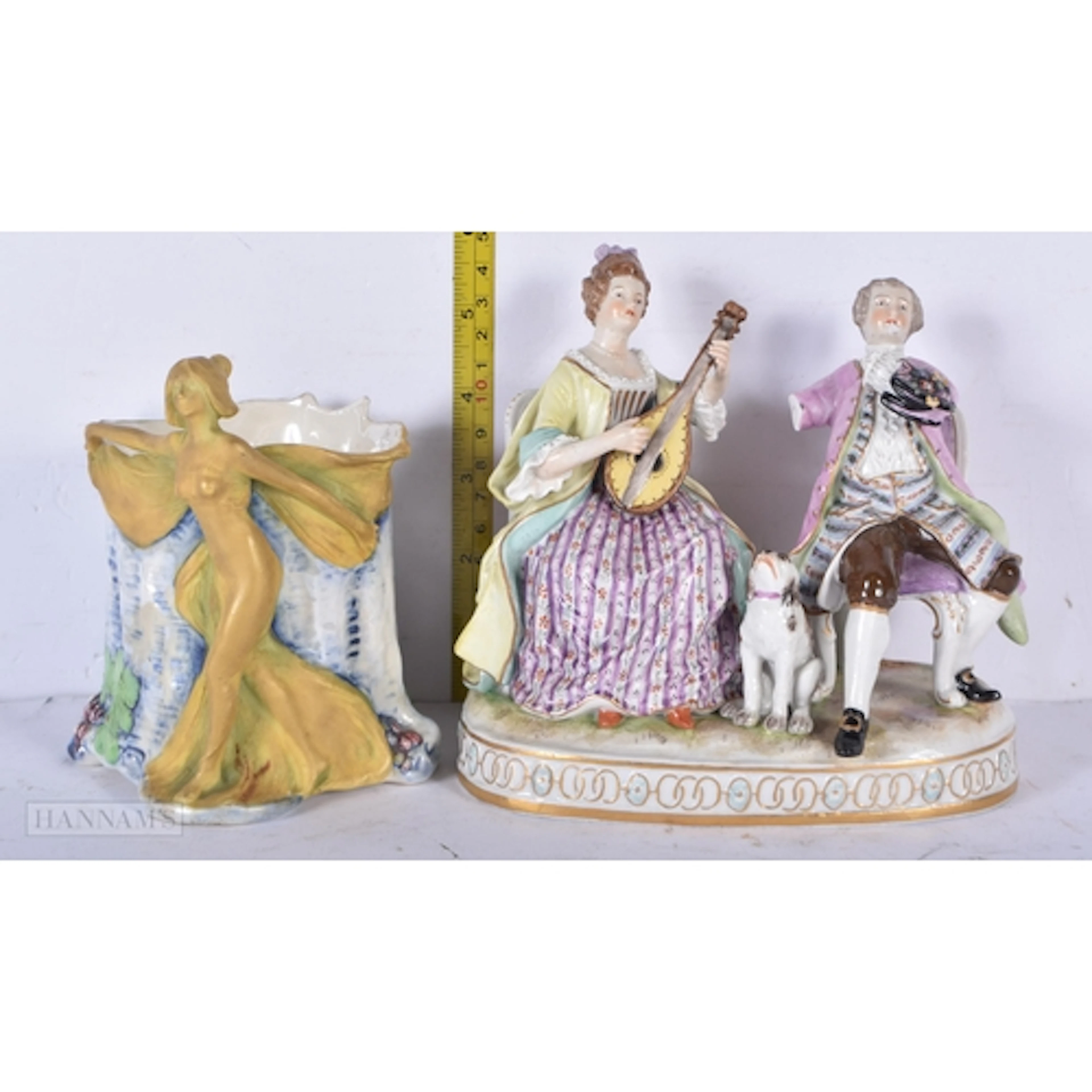 An antique Austrian porcelain Bacchus mug together with a Dr...