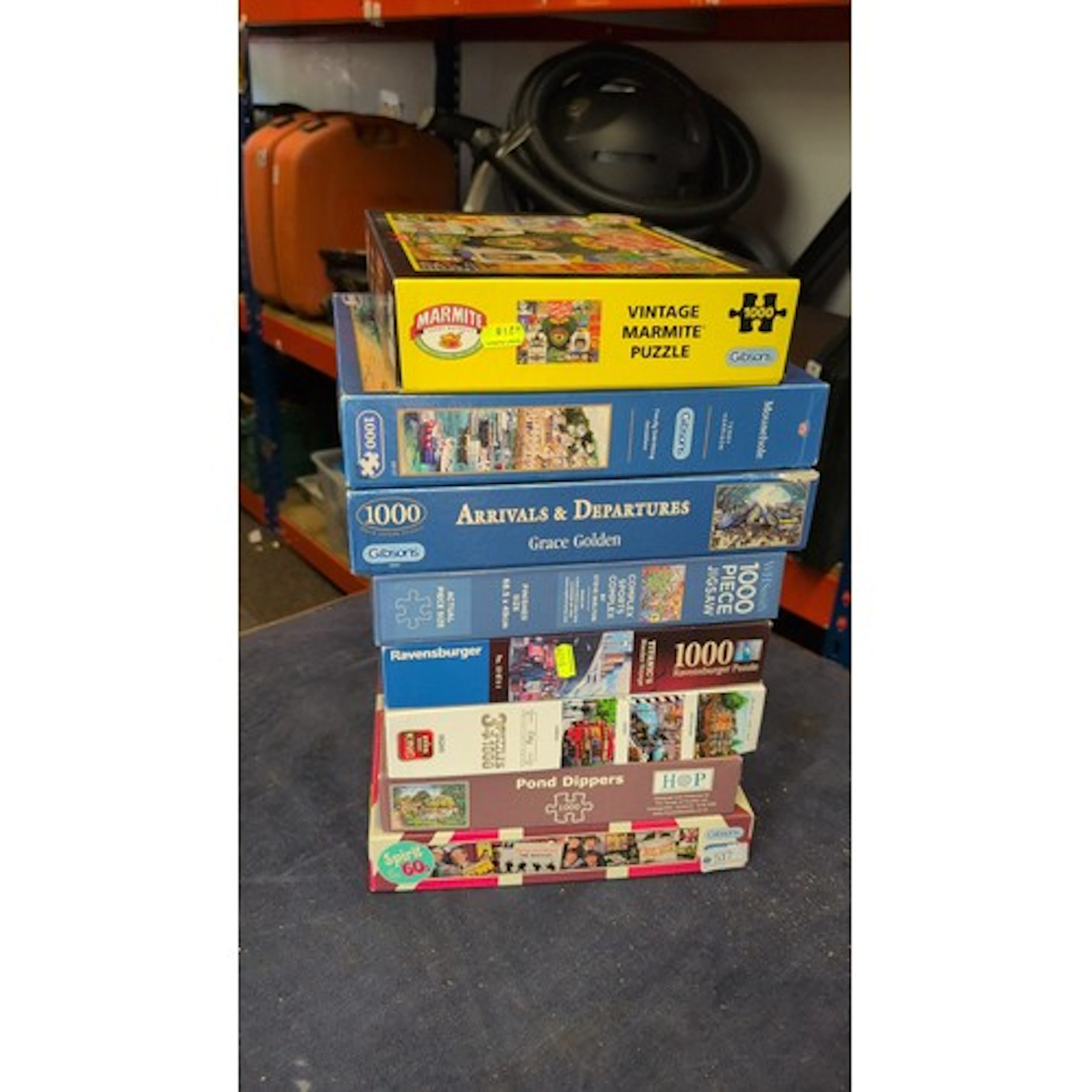 A group of boxed jigsaw puzzles, largely 1000-piece examples...