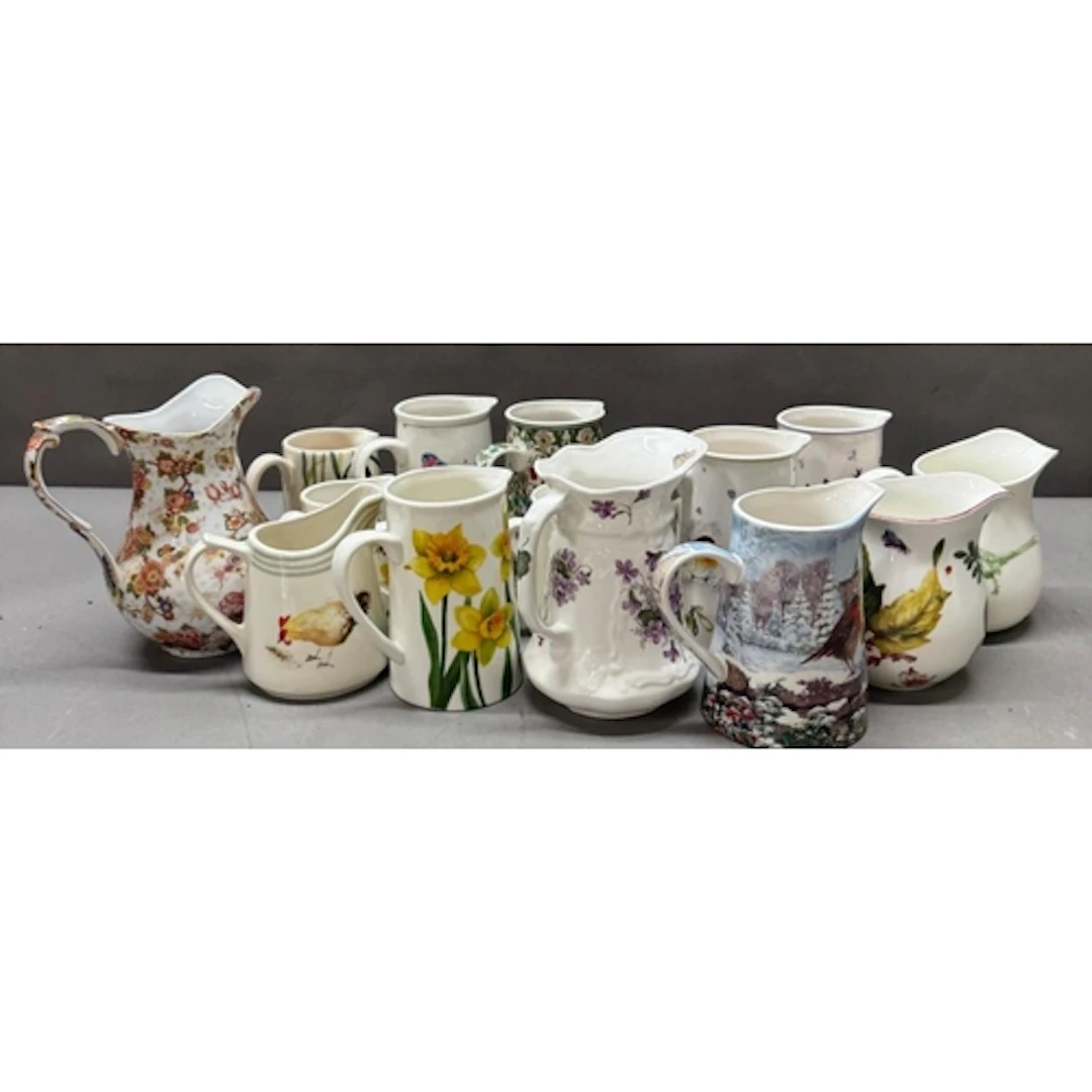 A selection of china jugs variuos sizes and makers.