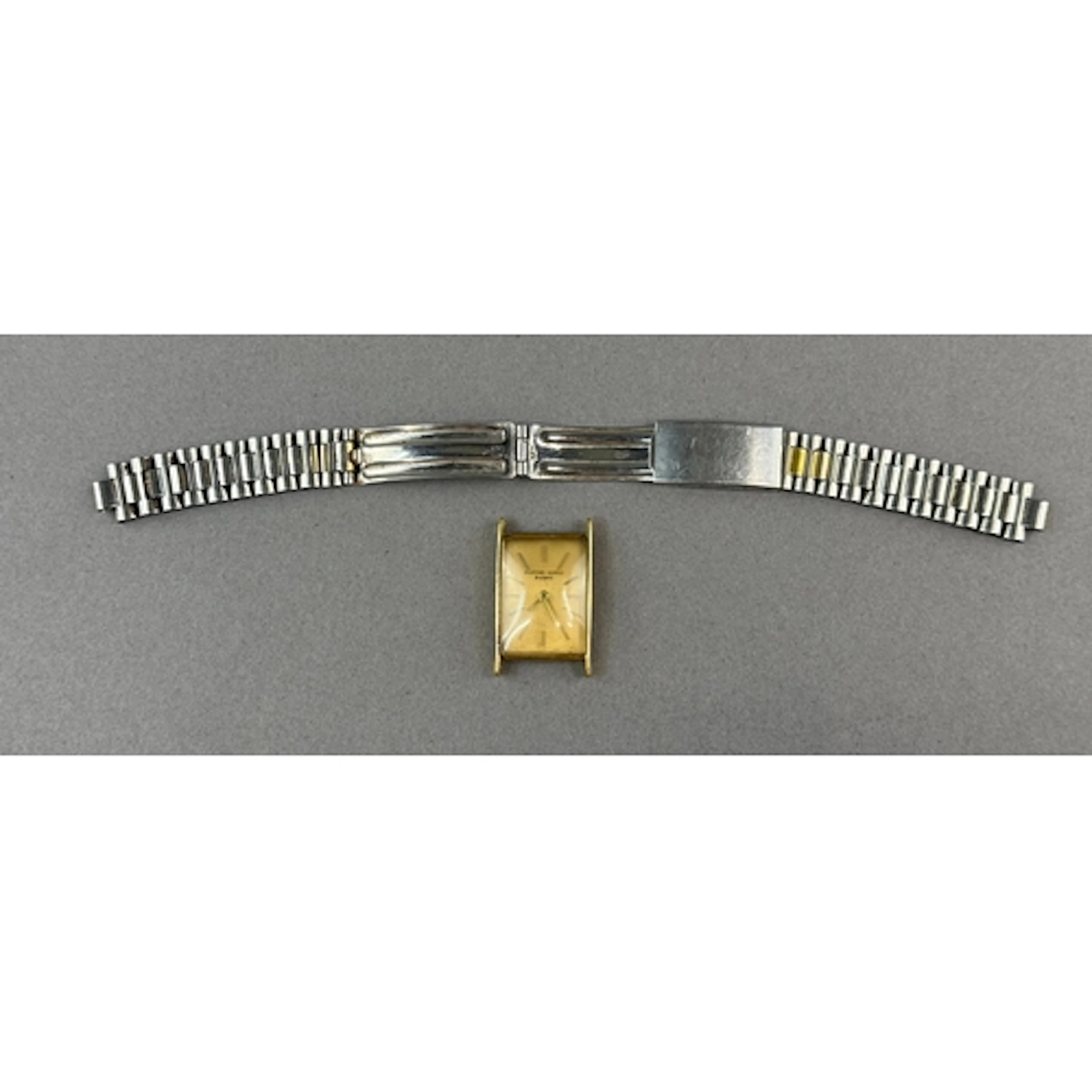 Watches: a gentleman's rectangular cased yellow metal watch ...