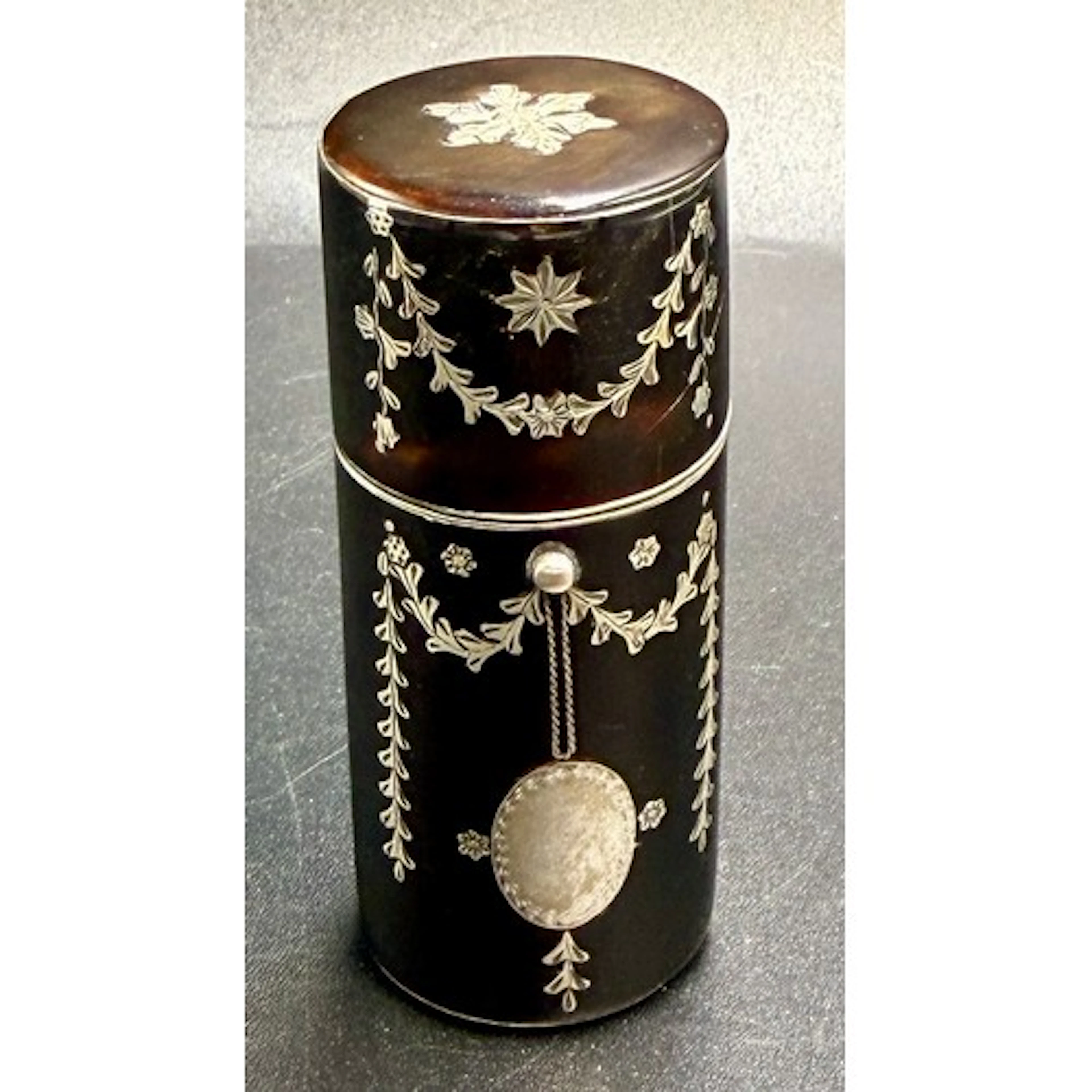 A 19thC glass scent bottle cased in a tortoiseshell pique ca...