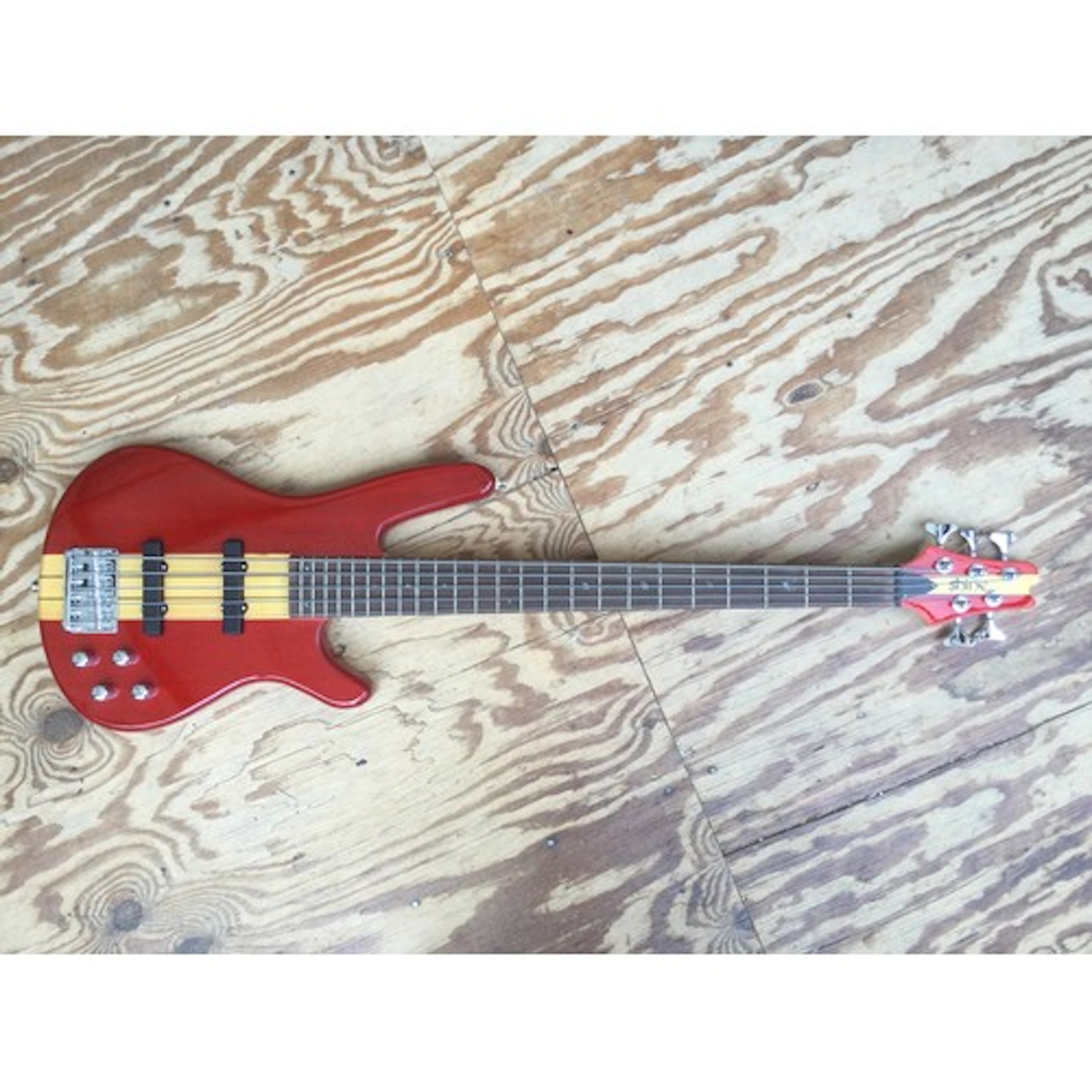 A Shine 5 string bass guitar. Comes with a soft carry case.