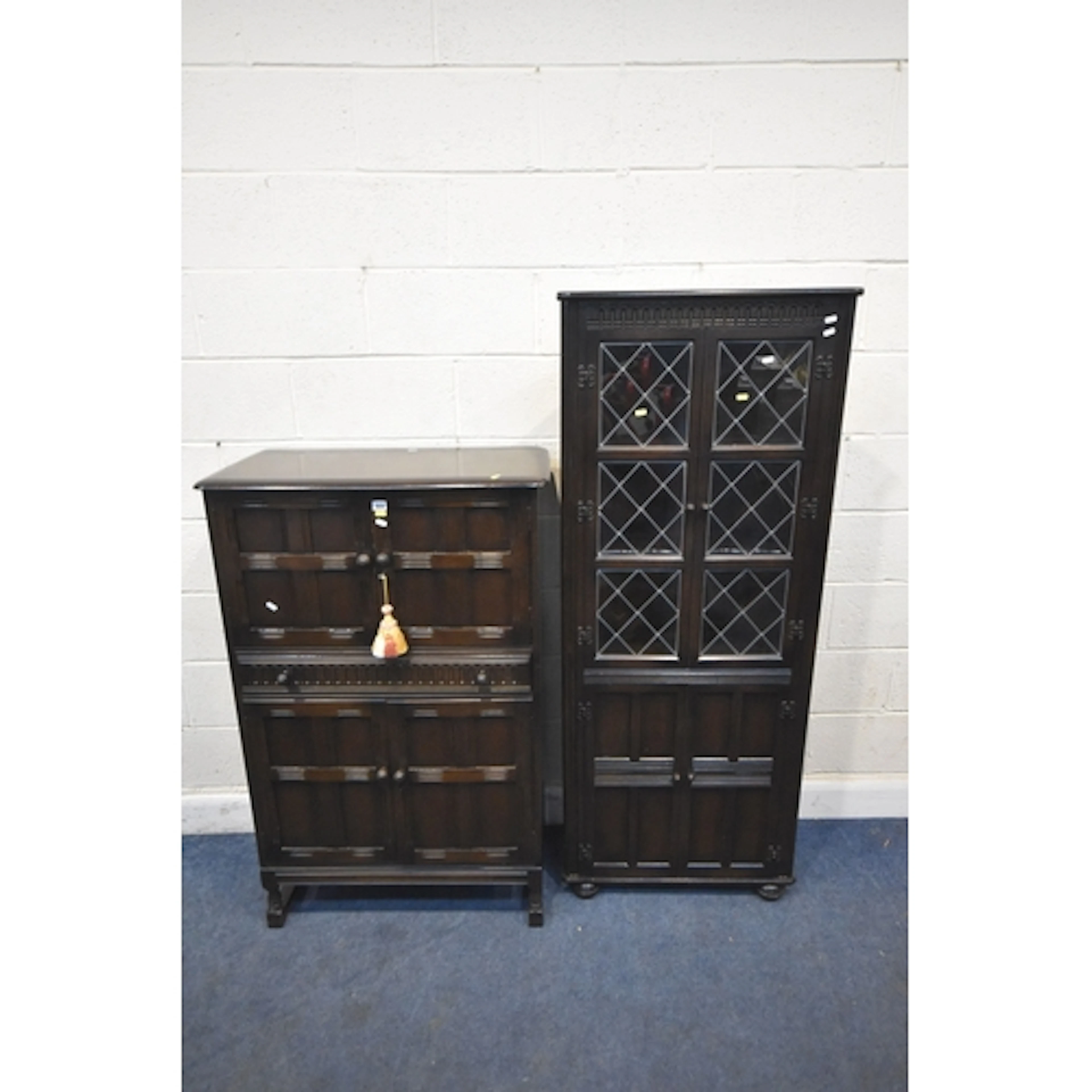 A PRIORY OAK COCKTAIL CABINET, the top double cupboard doors...