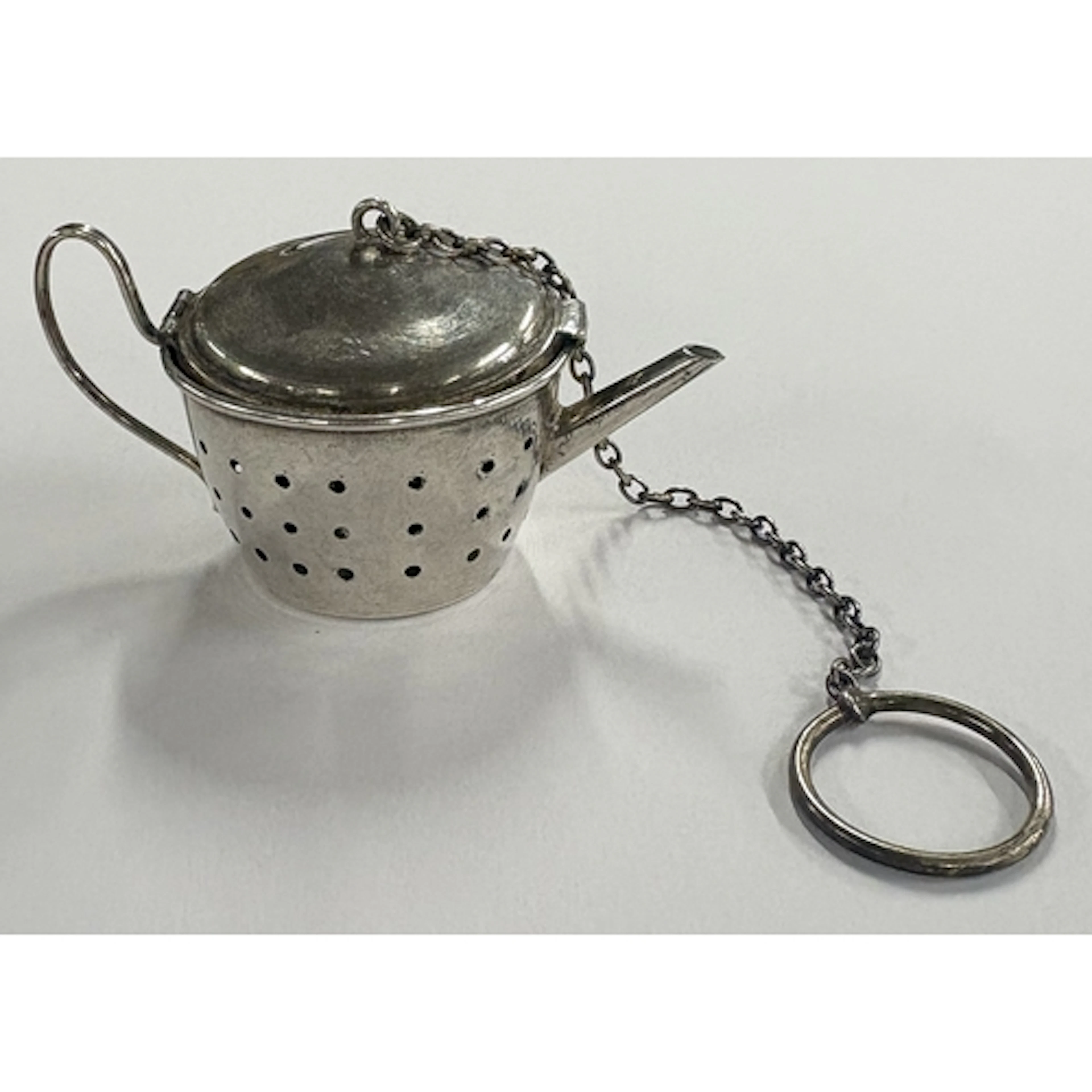 An American silver tea infuser in the form of a teapot, mark...